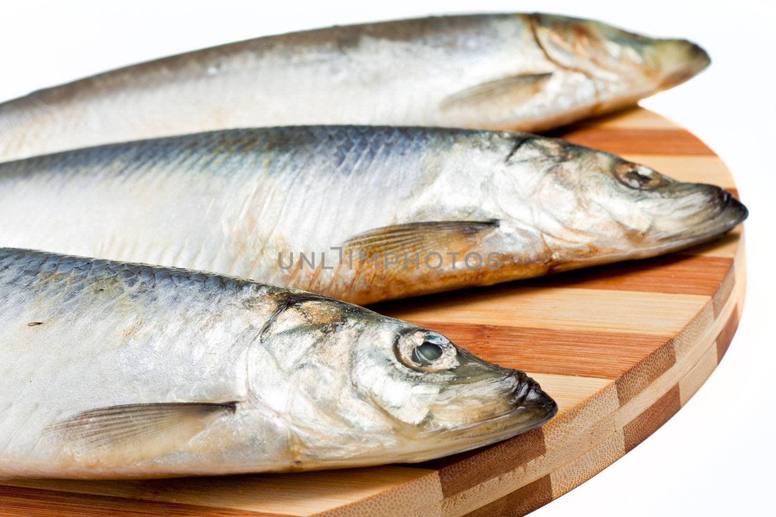 Fresh fishes on white background by shutswis