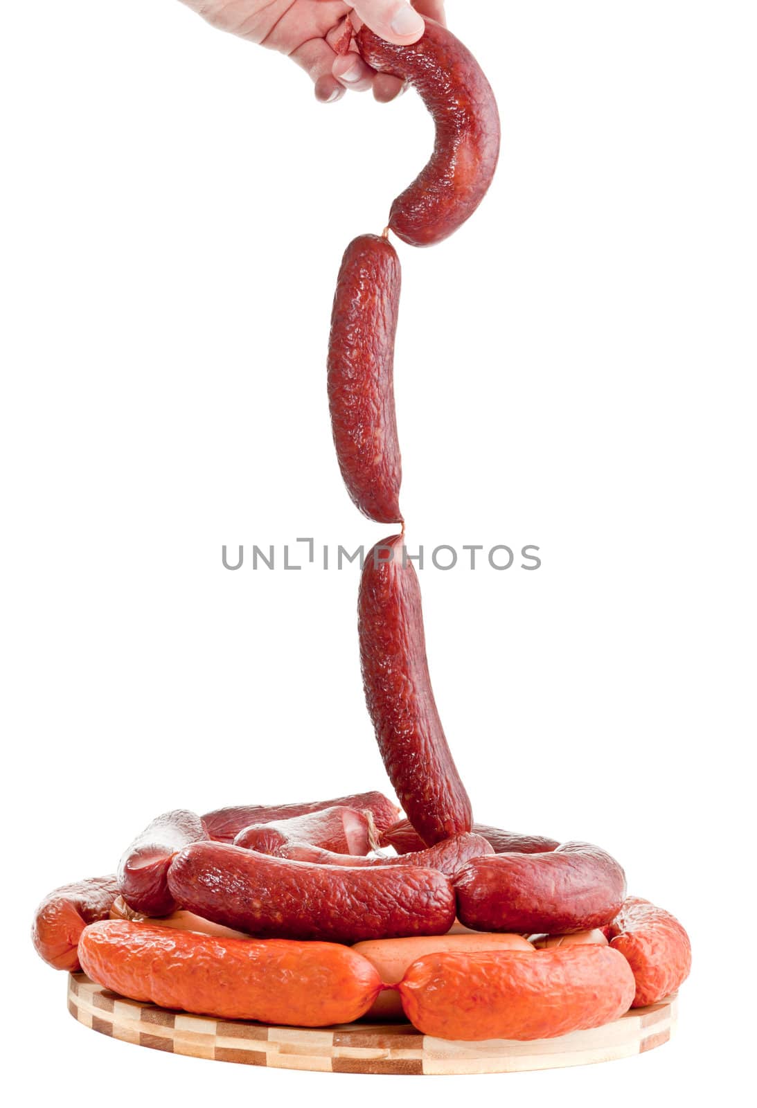 Sausages in hands on a white background by shutswis