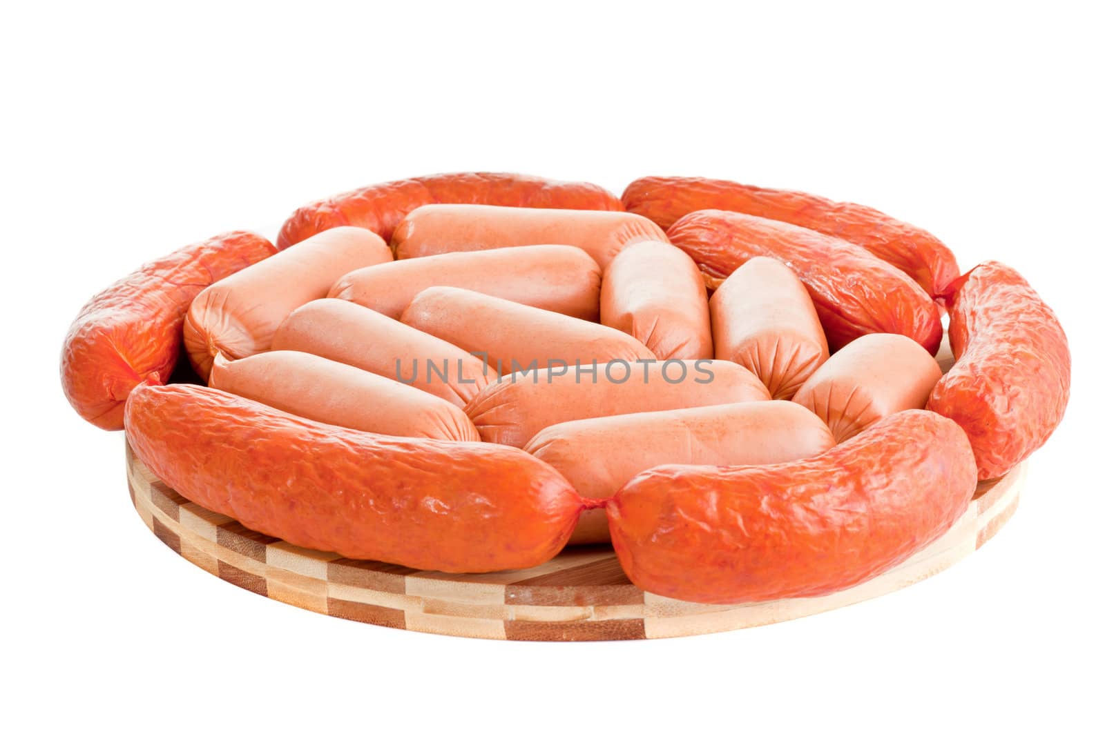 delicious sausages on board isolated on white