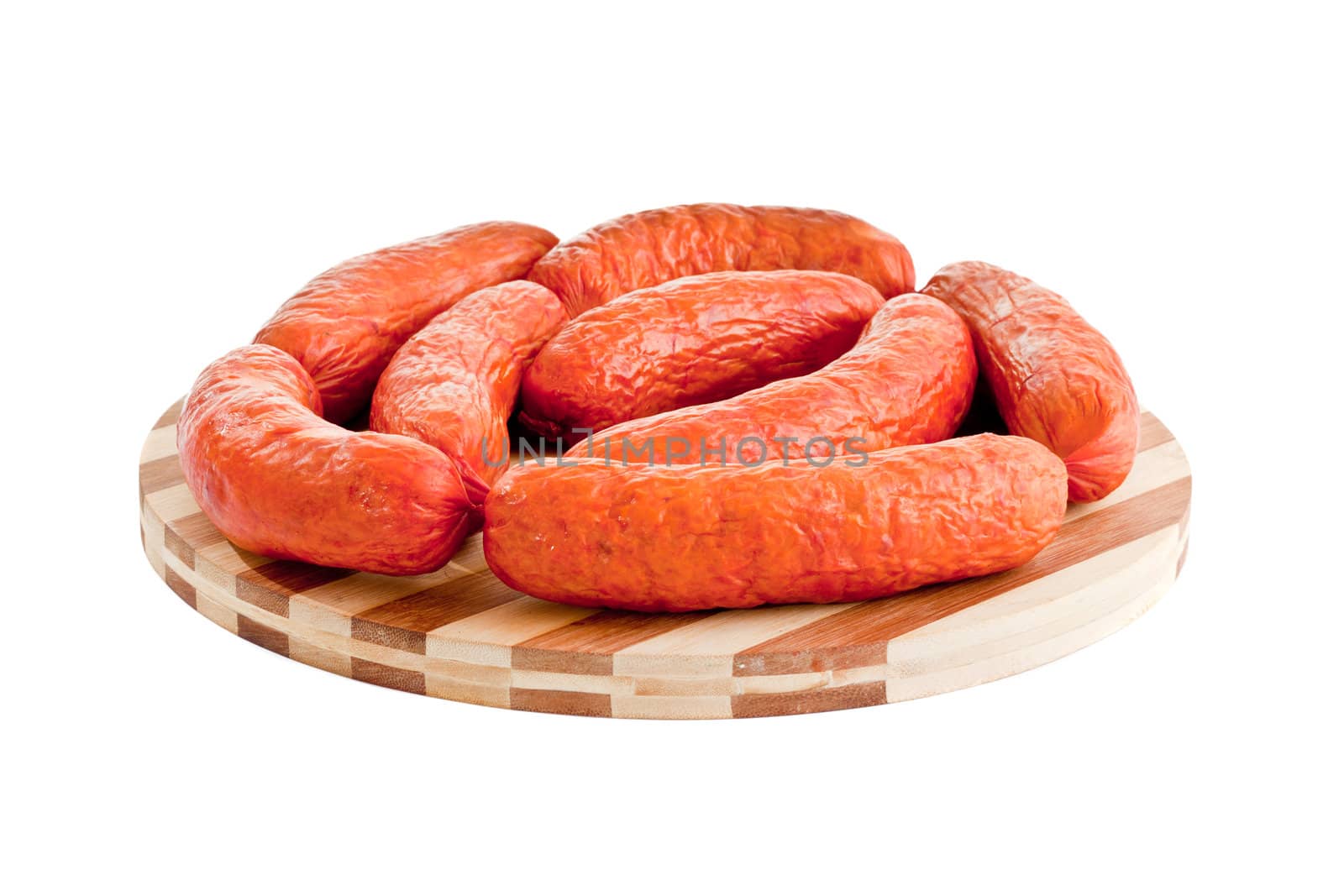 delicious sausages on board isolated on white