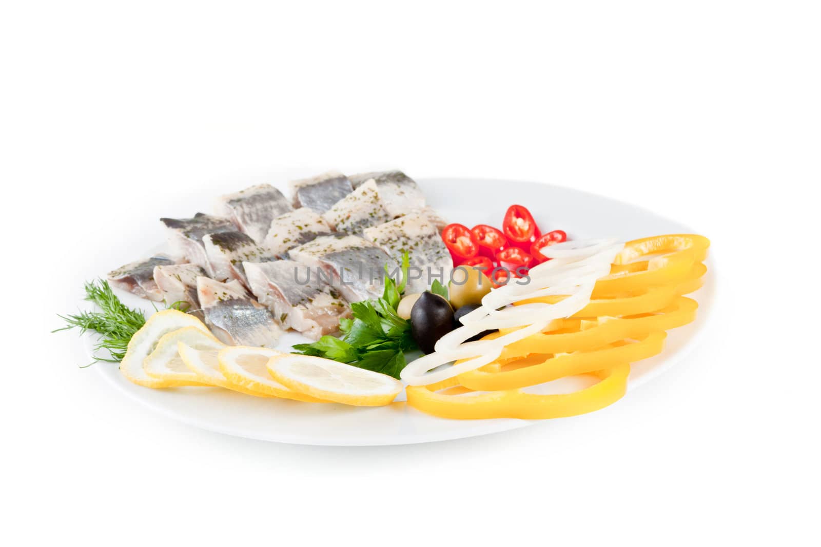 fish with vegetables and olives isolated on white