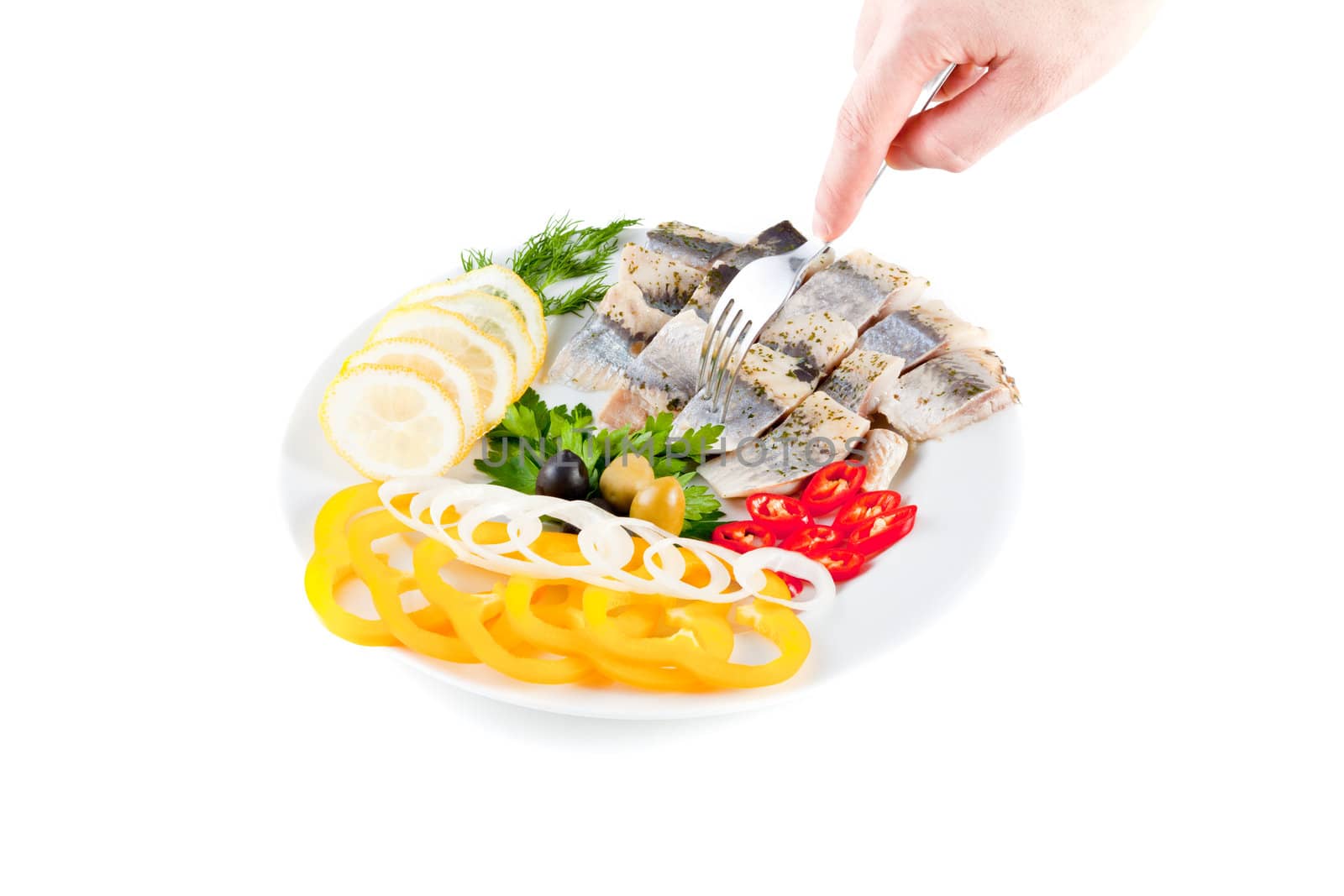 fish on plate with vegetables isolated on white