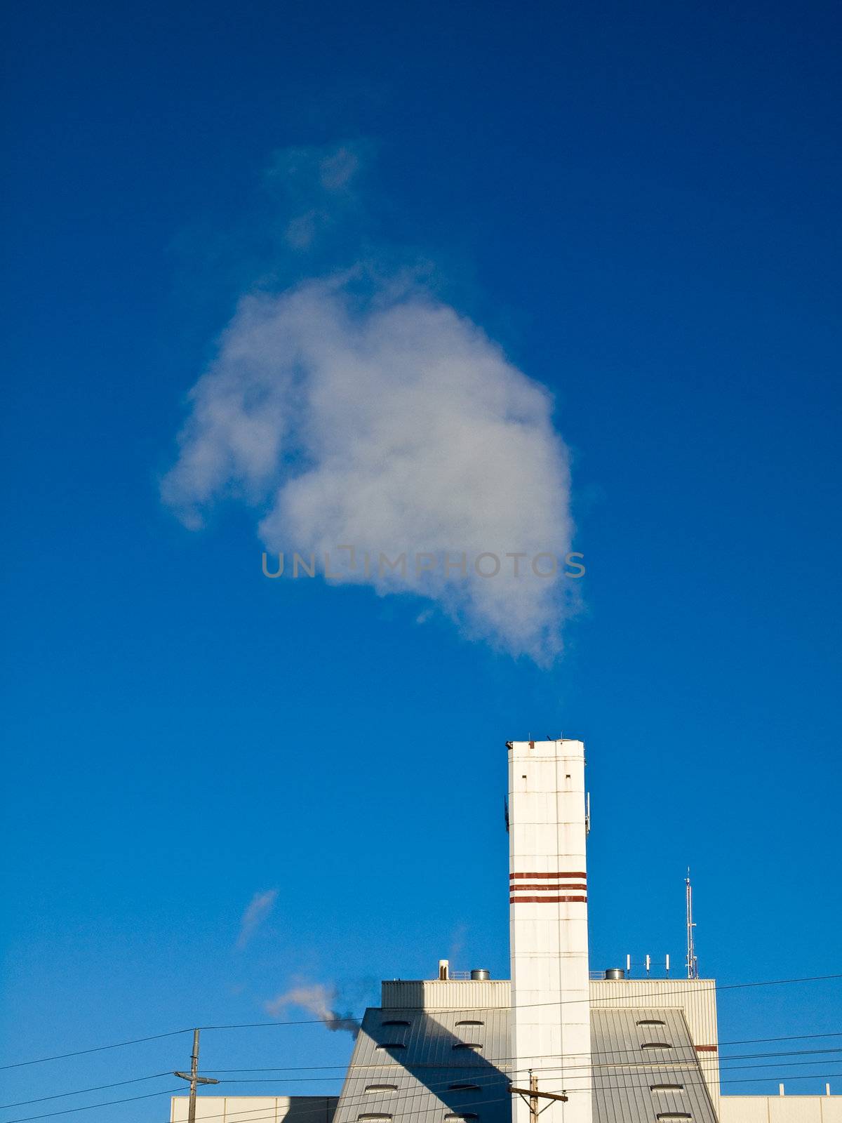 Waste to Energy Plant with Smoke Coming Out of a Smokestack 