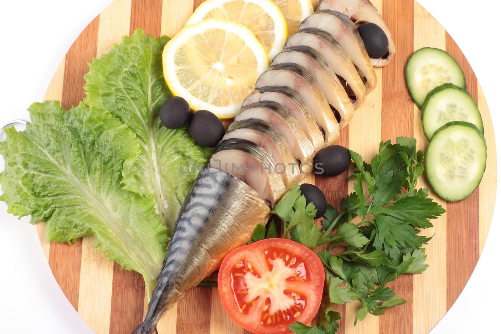 sliced herring on wooden plate close up