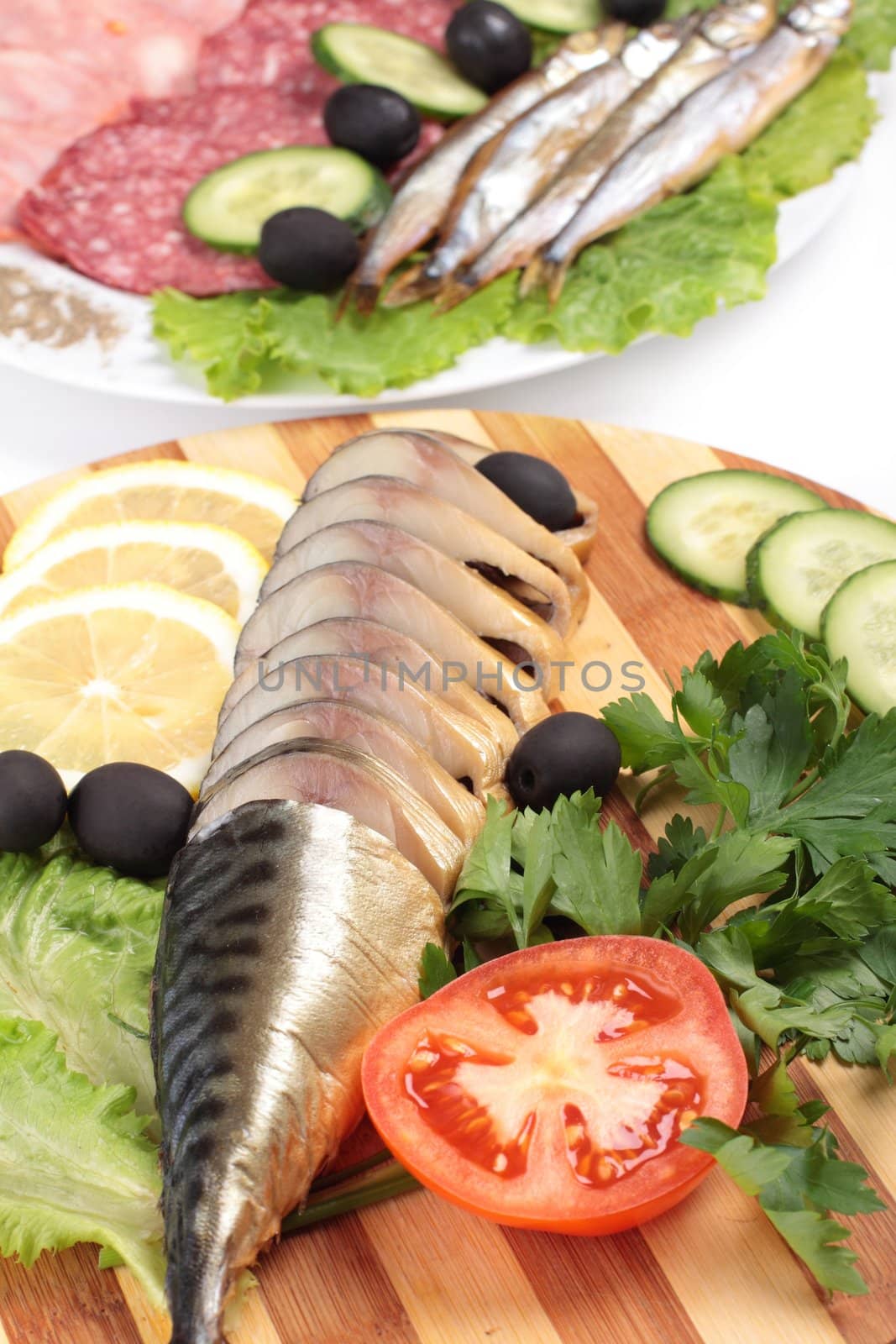 sliced herring on wooden plate close up