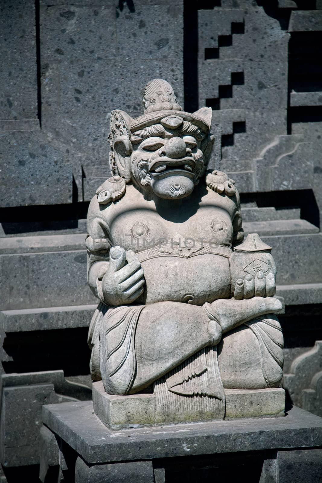 Traditional Balinese god statue in front of the temple