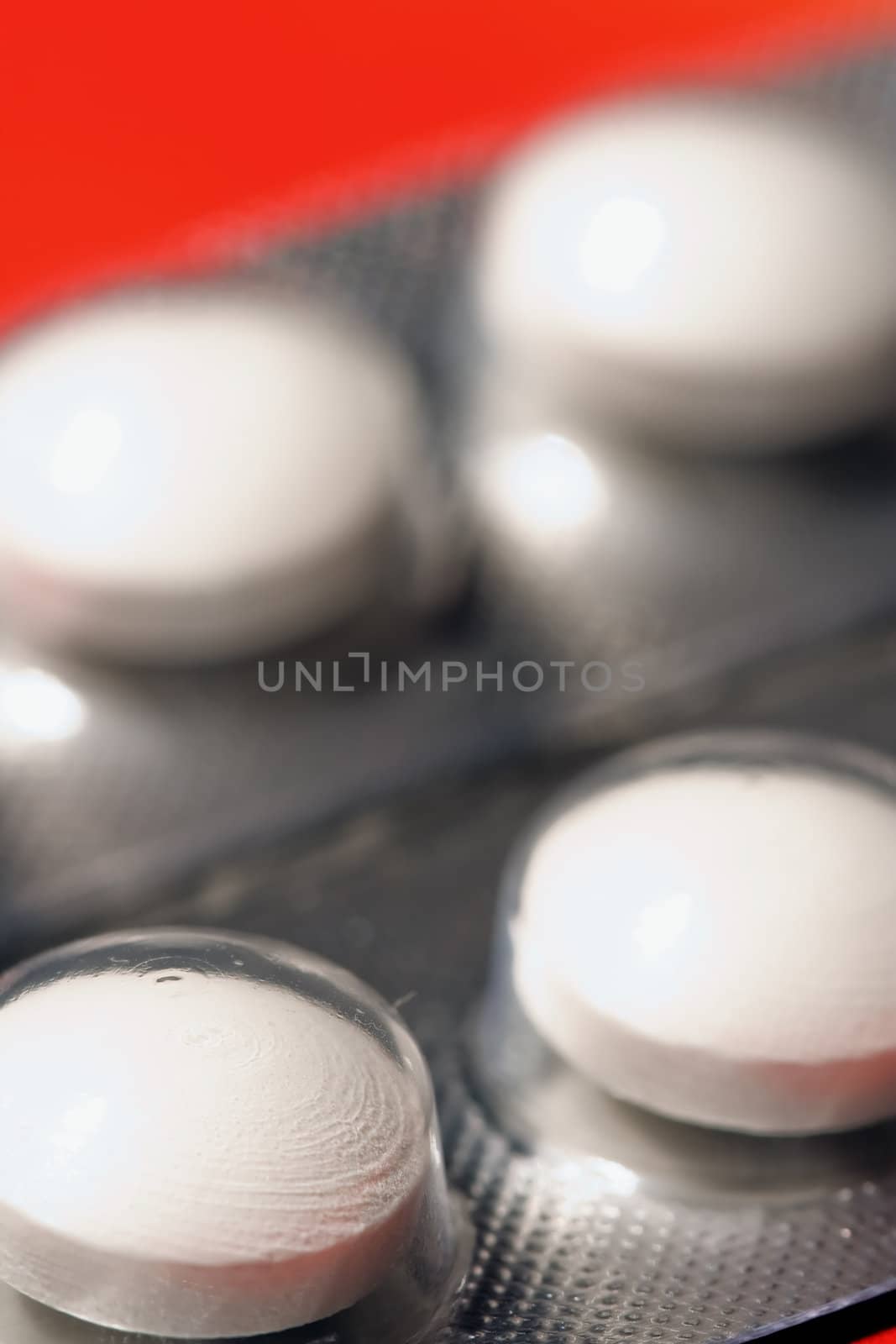 Macro of pills on orange background