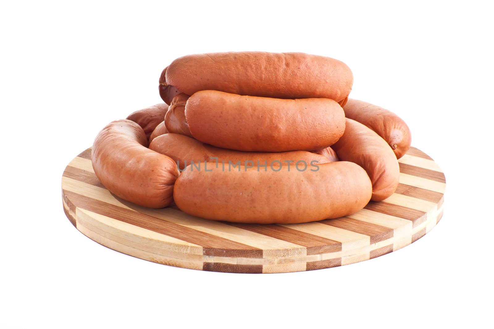 delicious sausages on board isolated on white