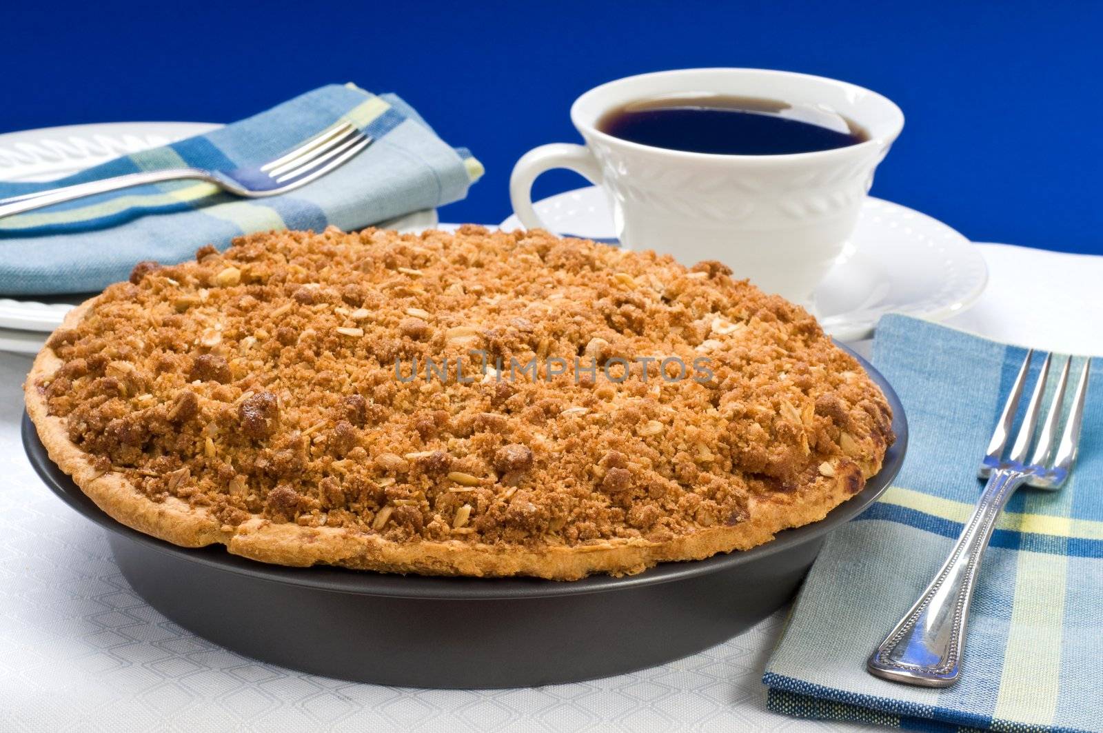 Fresh baked apple crumble pie and coffee.