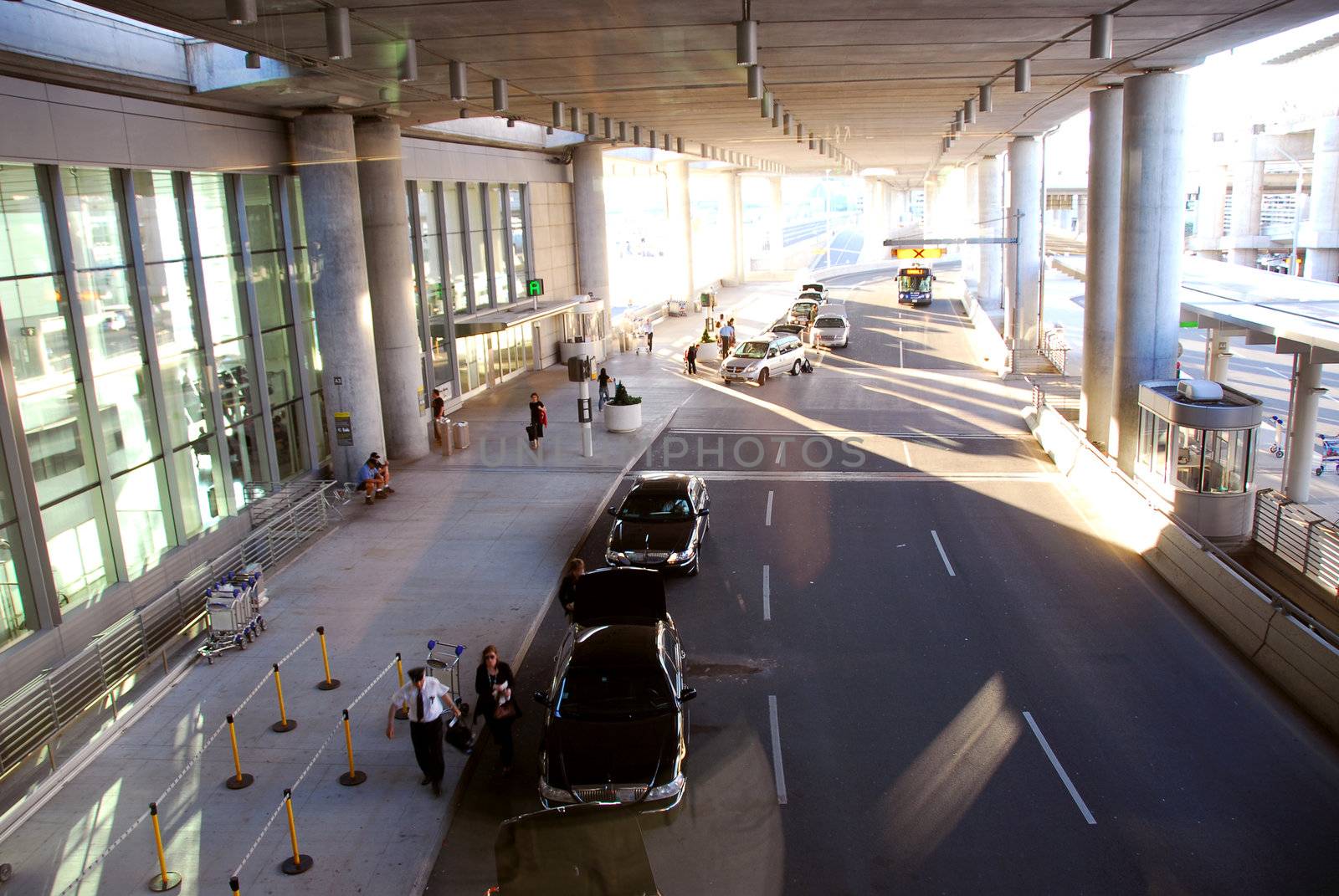 Travelers getting taxis at airport