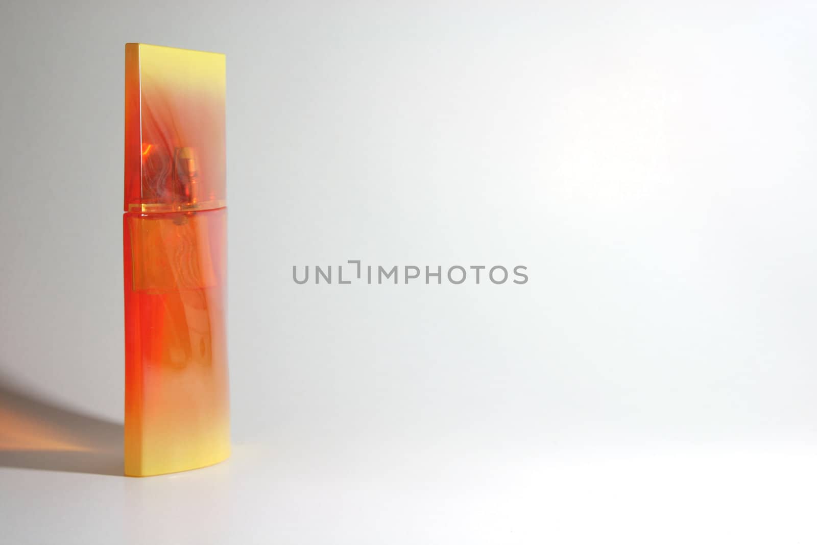 designed orange yellow perfume bottle
