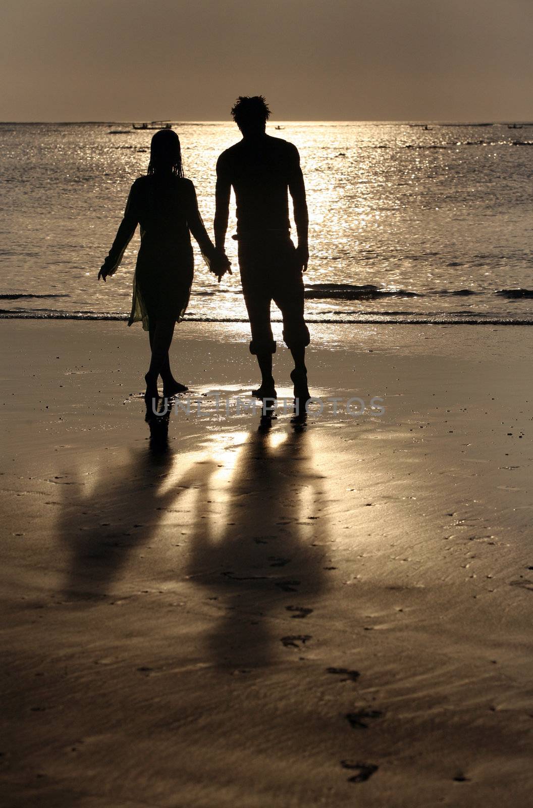 Couple on sunset. Coast of the Indian ocean