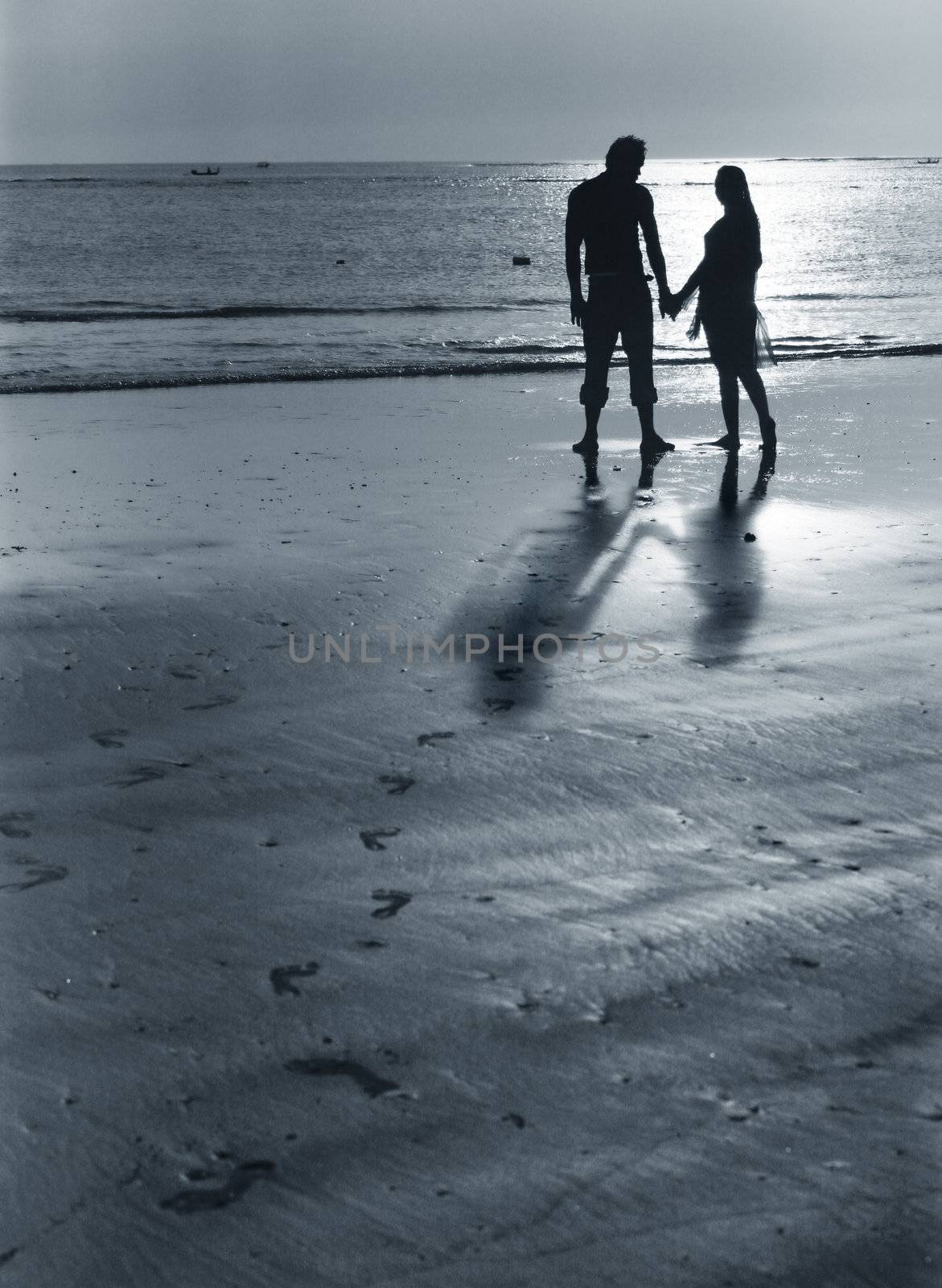 Couple on sunset. Coast of the Indian ocean