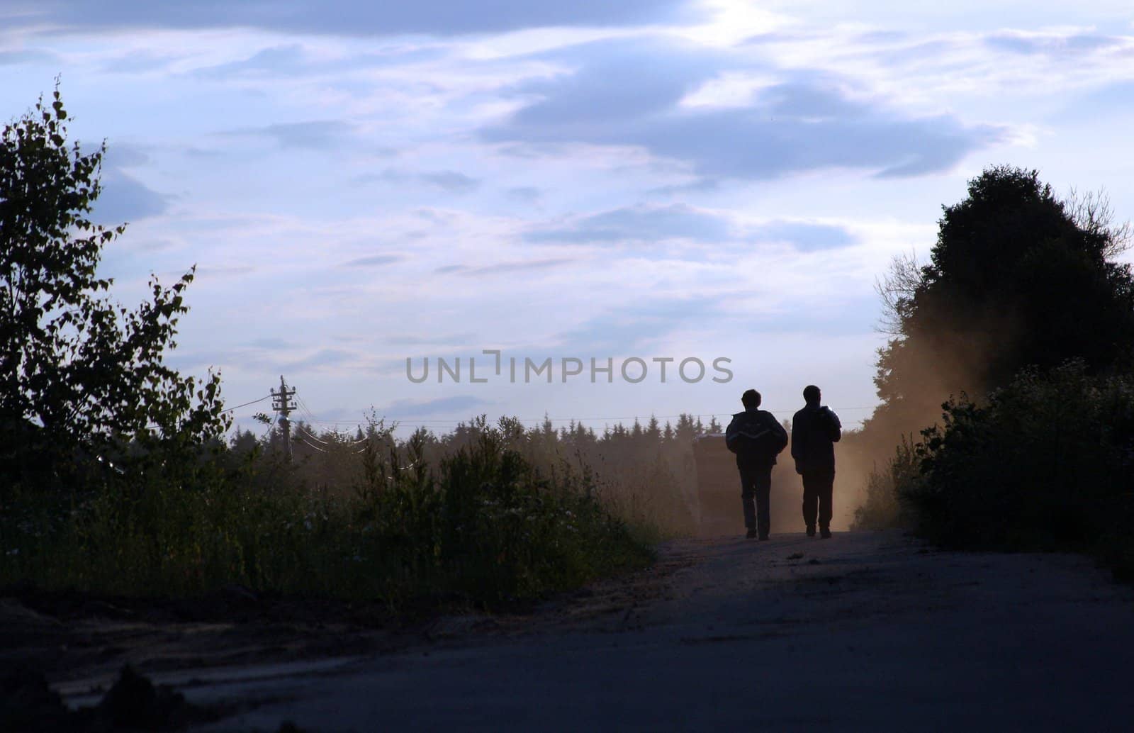 Two men on dusty road