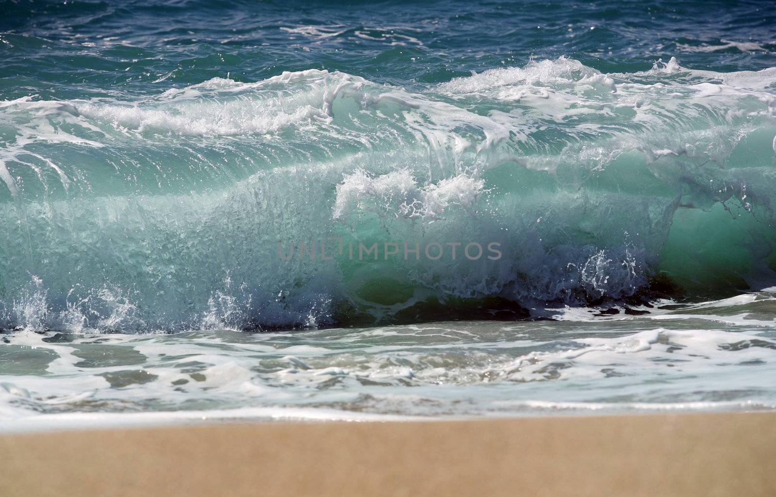 Blue coastal waves and sand
	 