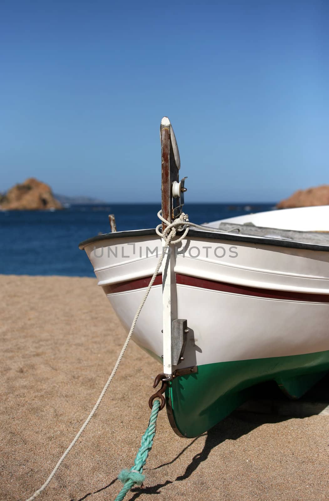Lonely the boat on seacoast. Spain. Tossa