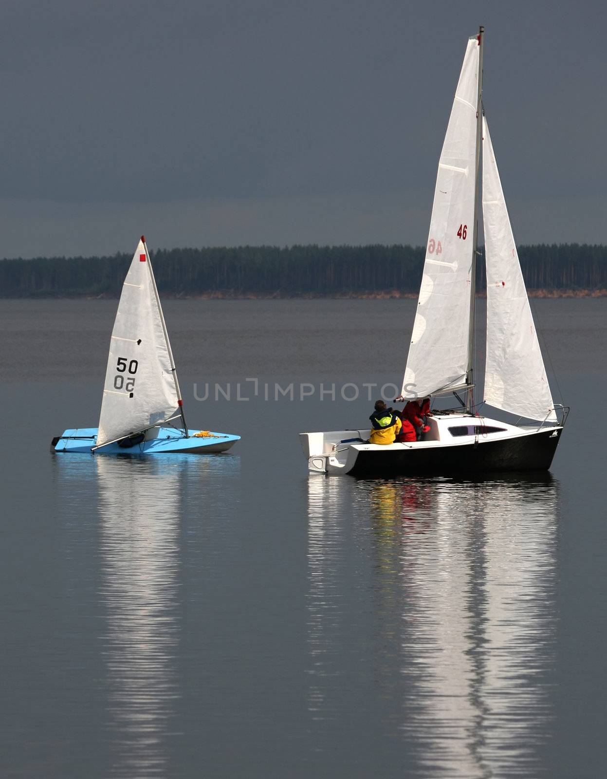 Two sailing boat at an open river. Russia