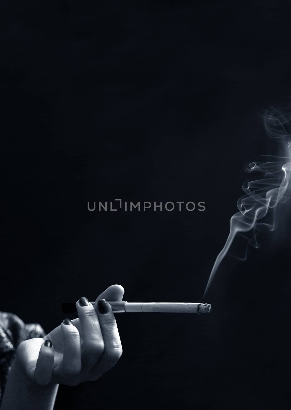 Hand with a cigarette by friday