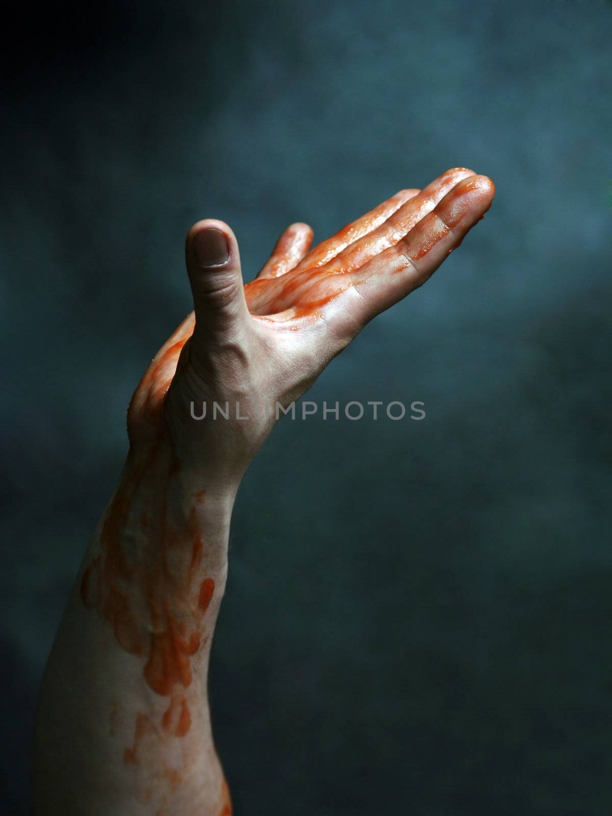 Man's hand on a black blue background