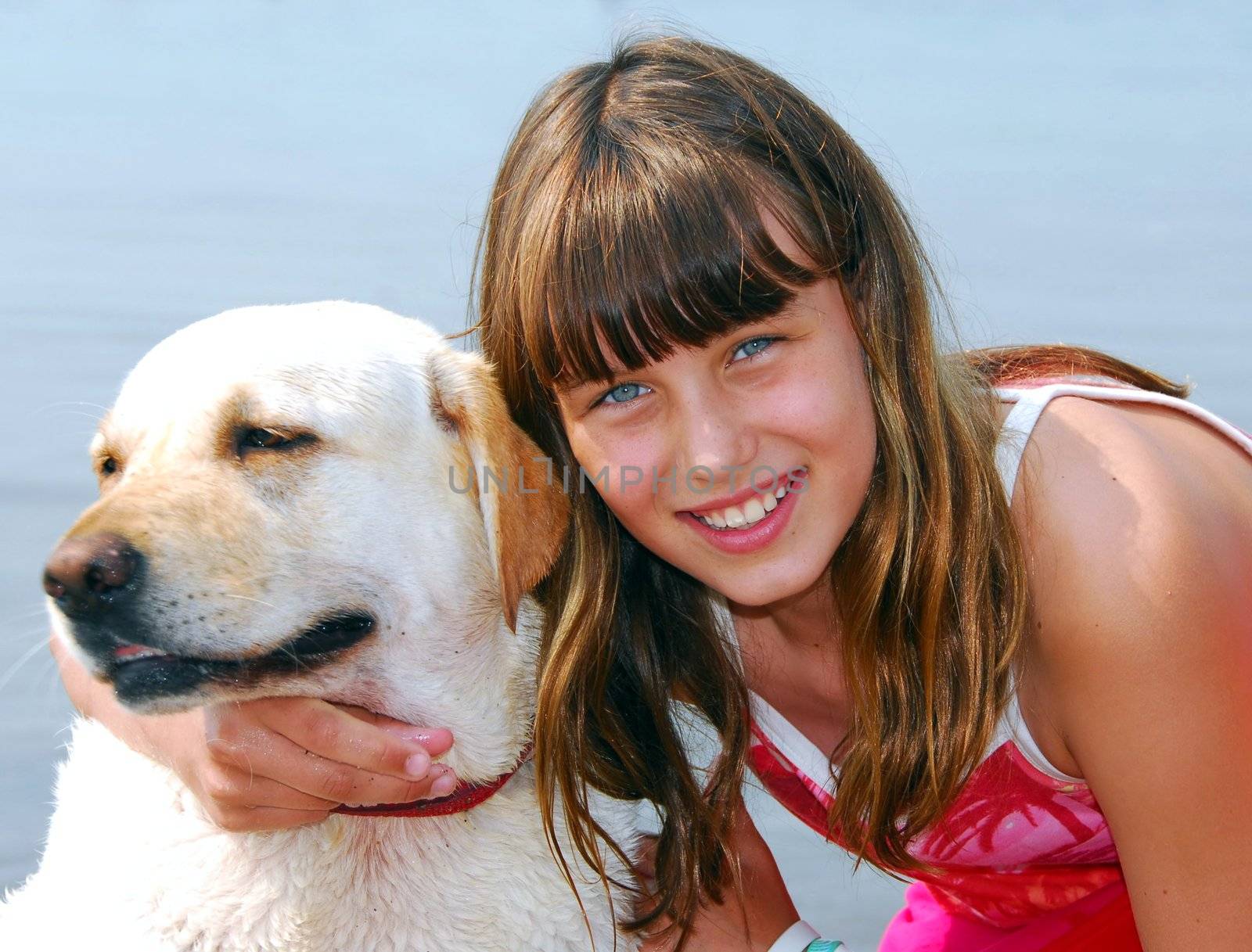 Portrait of a young girl with a dog