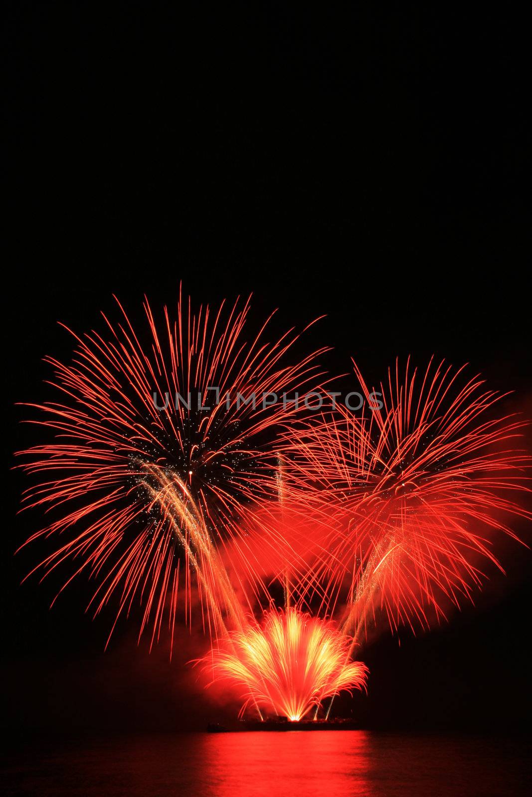 bright red fireworks against the dark sky
