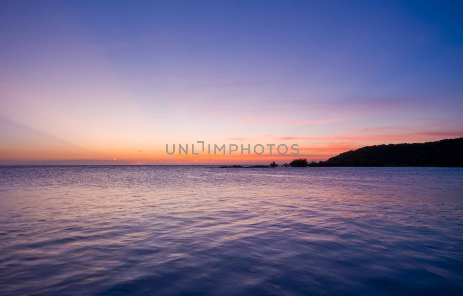 sunset over the sea with nice pastel colors with reflection in the sea