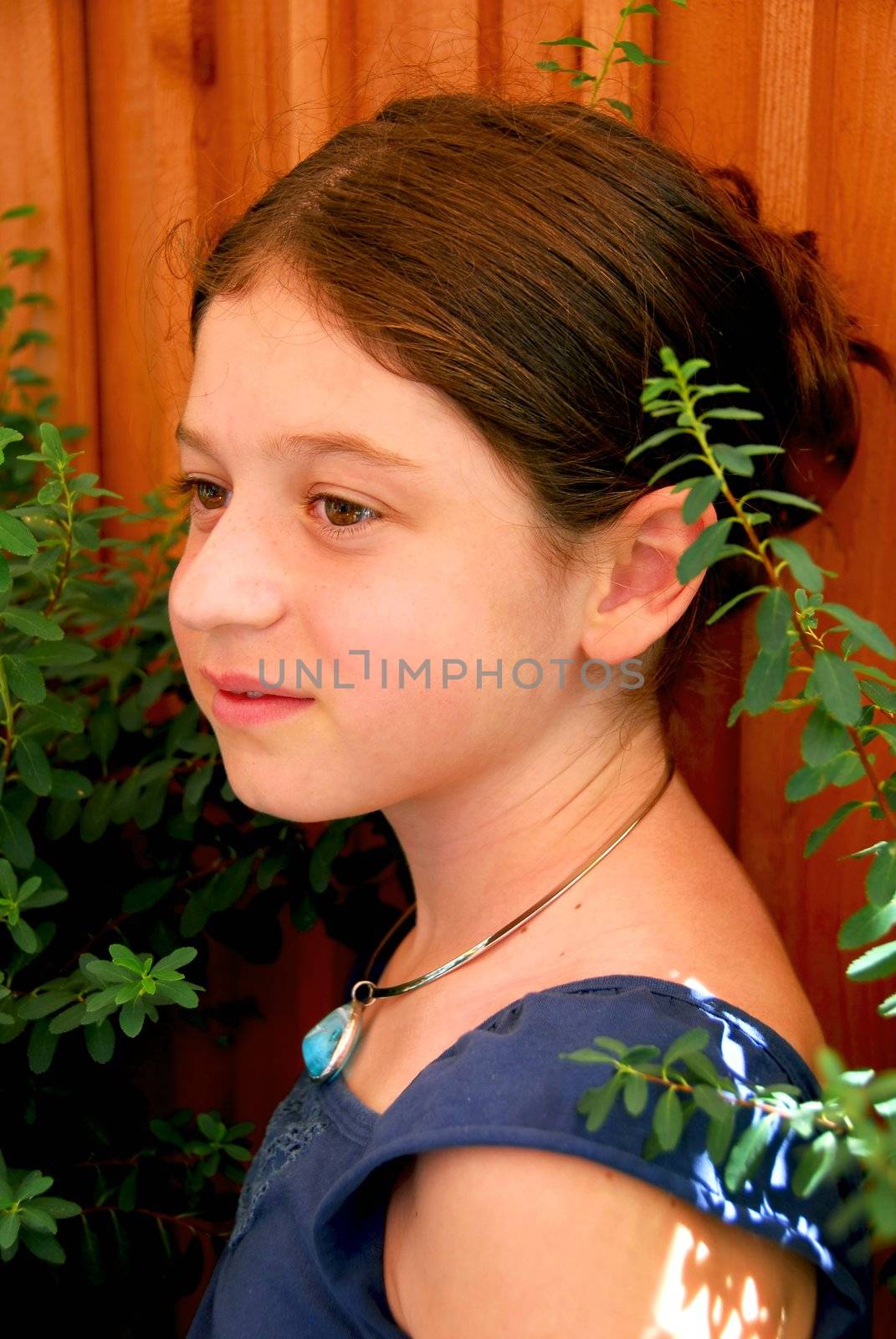 Portrait of a young girl wearing a necklace