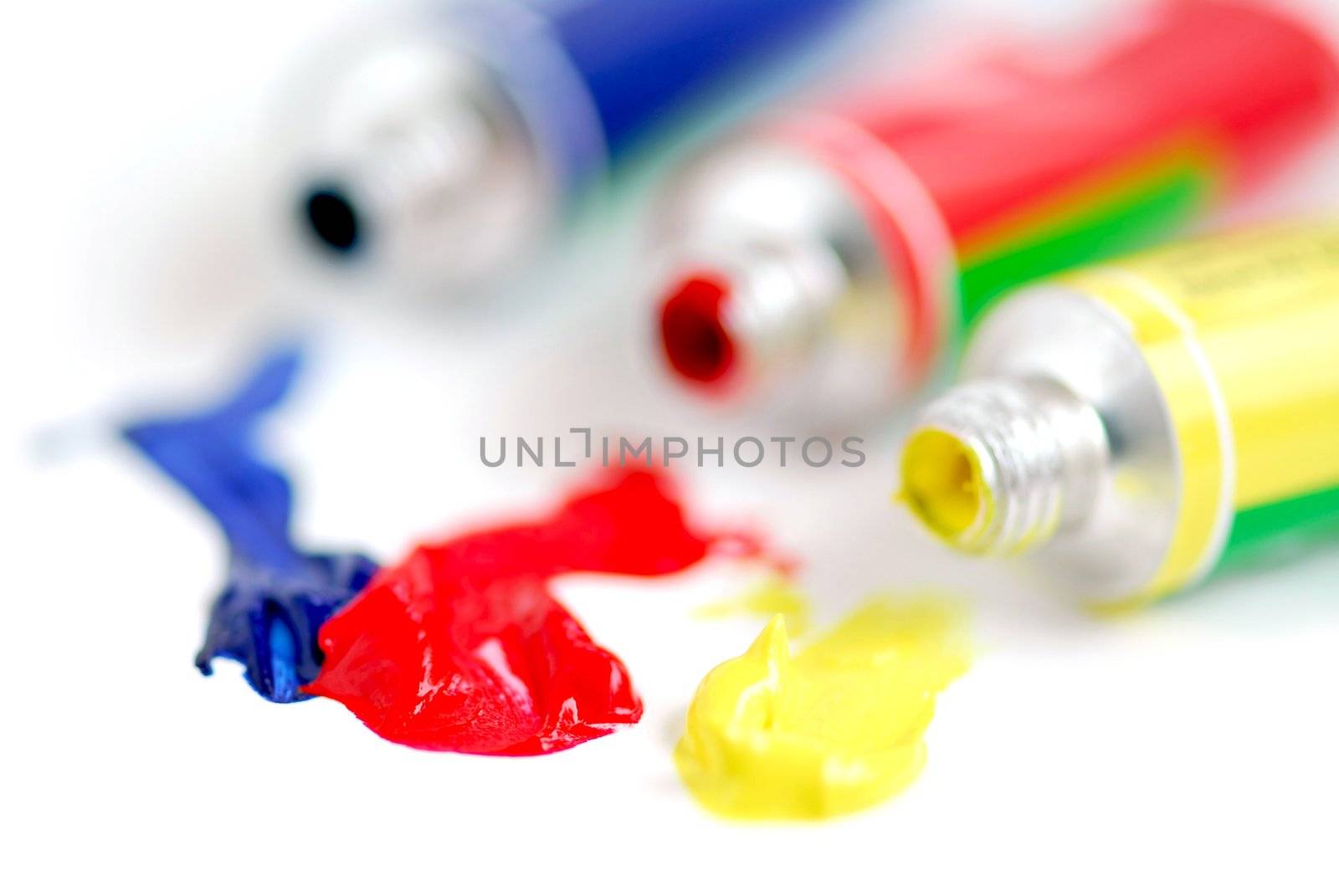 Macro of paint tubes of primary colors