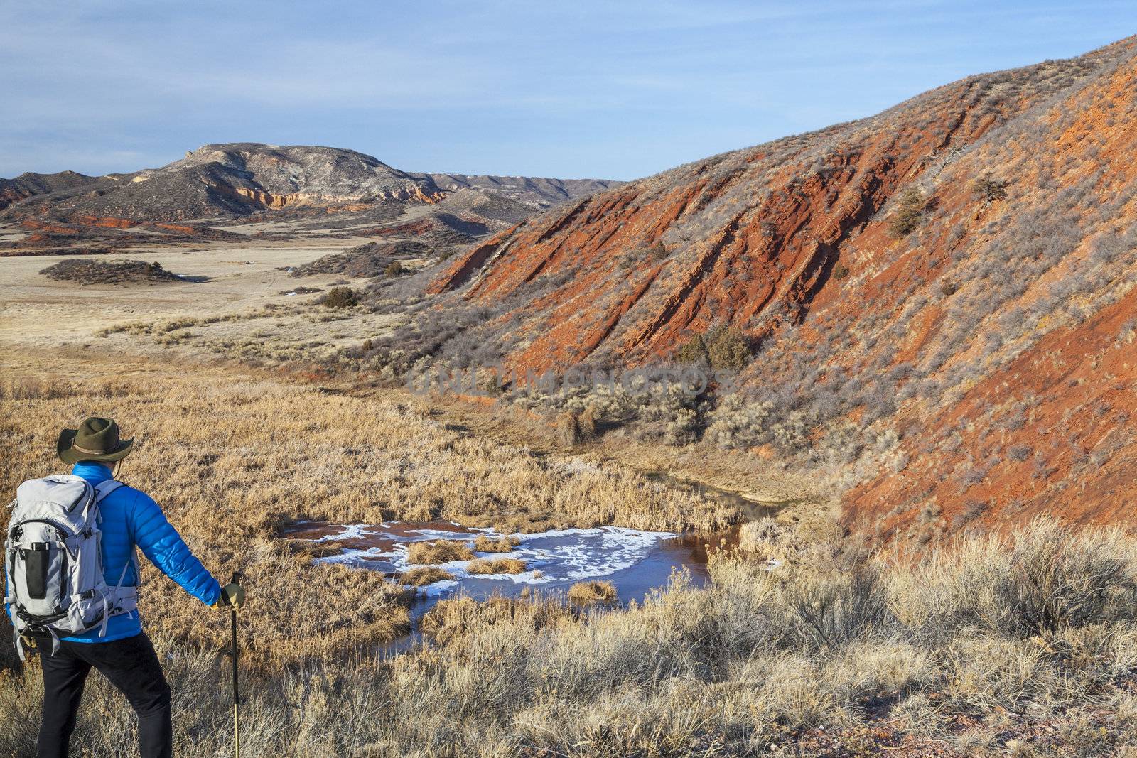 hiker in a rugged Colorado landscape by PixelsAway