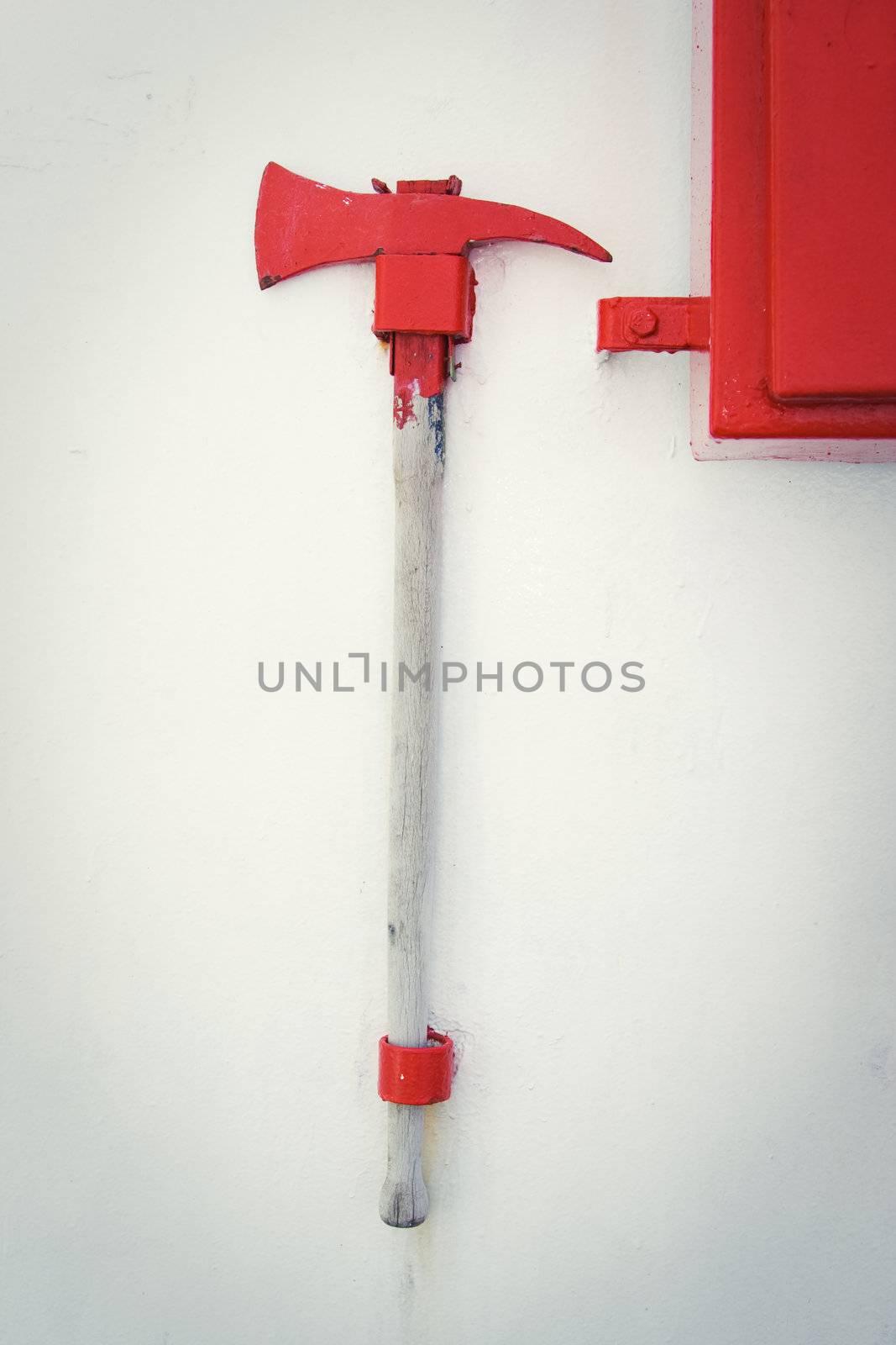 Firefighter axe on the cruiser boat wall by Lizard