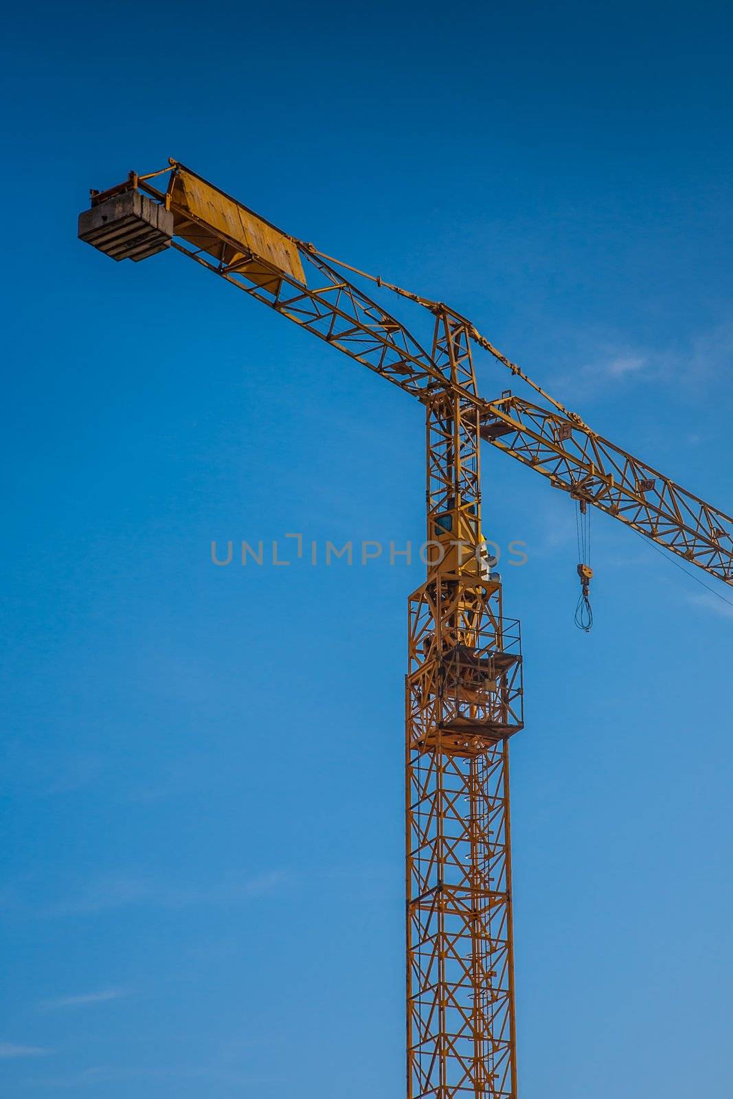 big yellow construction crane  on building site