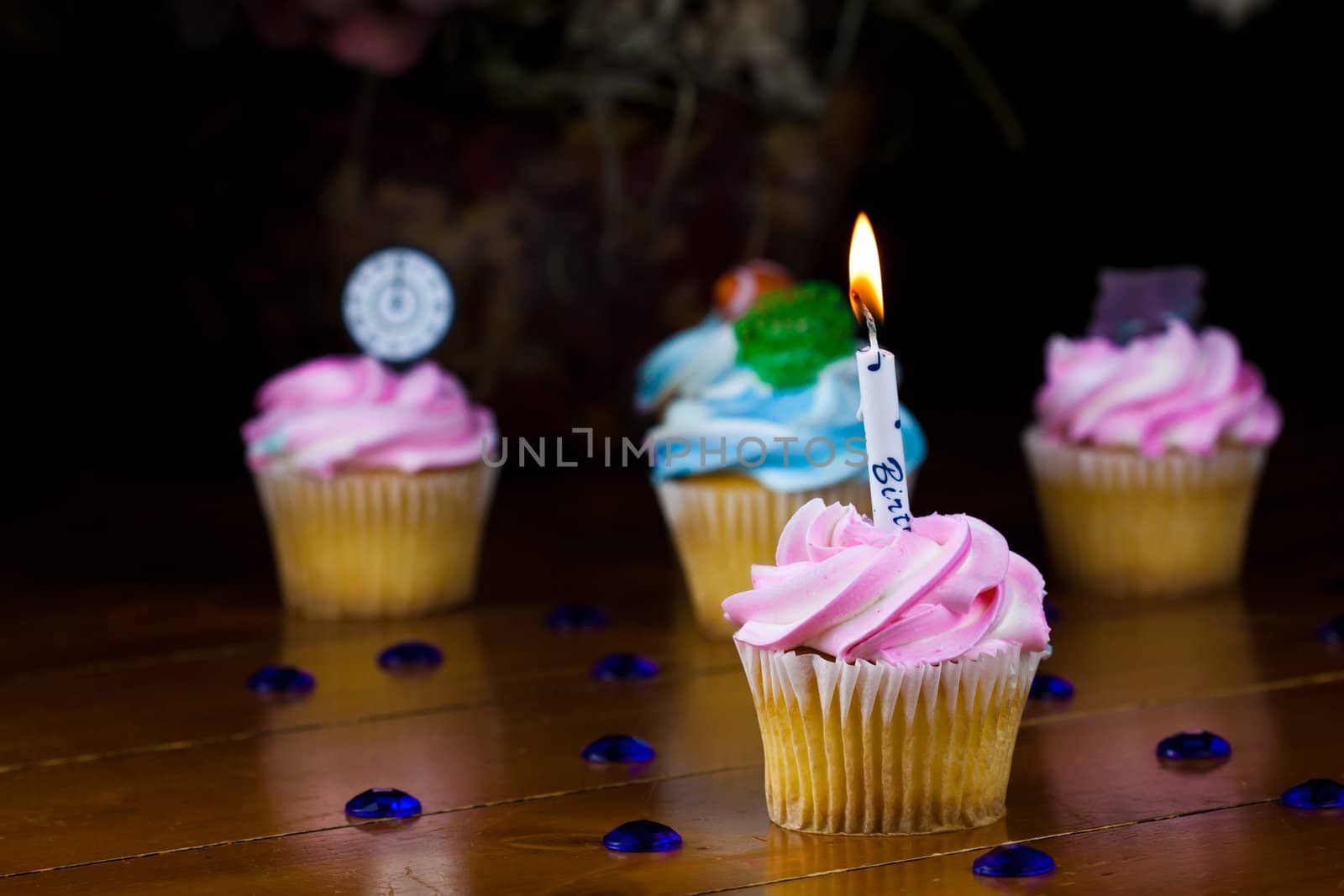 Close up of a cup cake on the wooden table