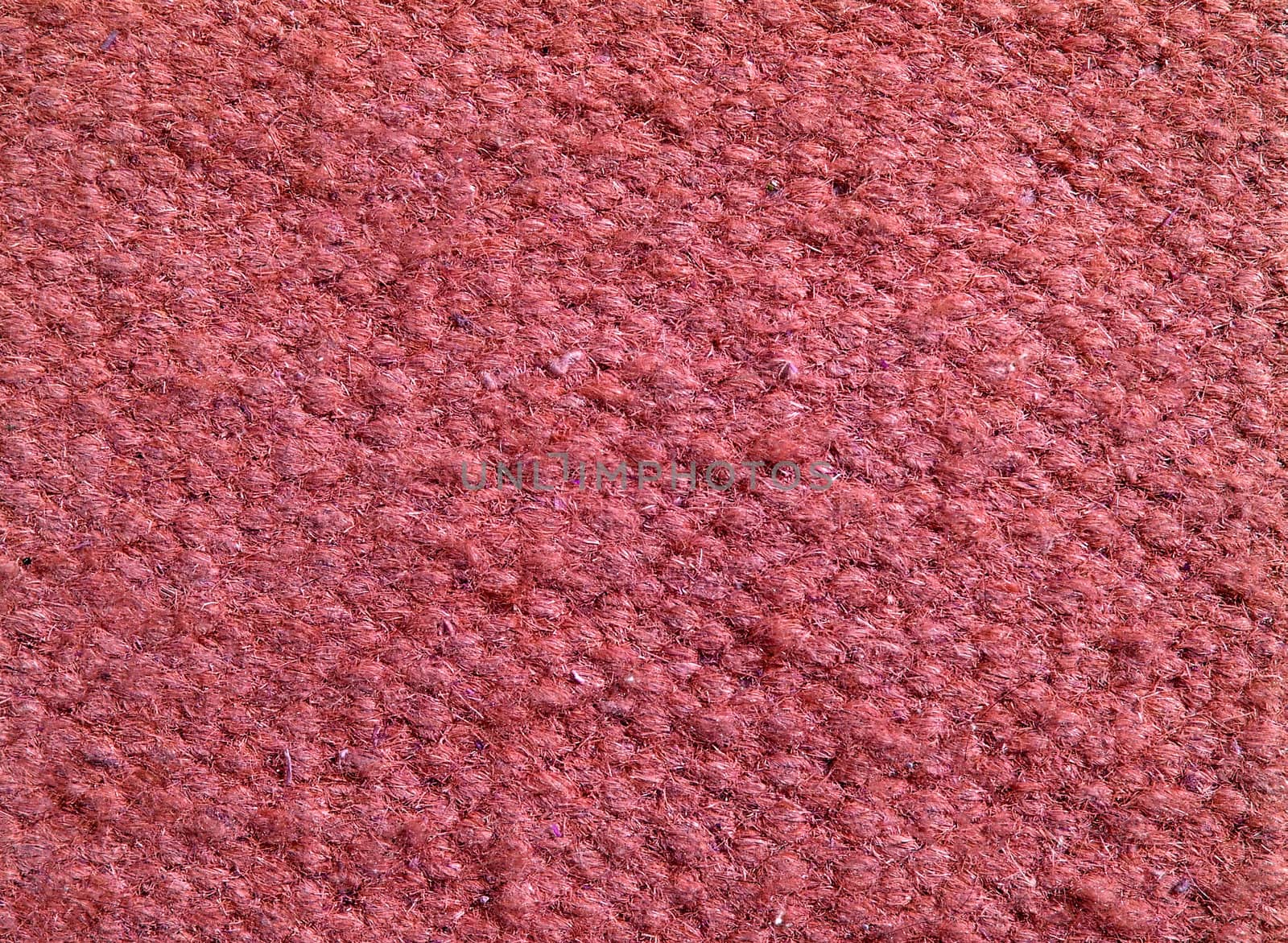 Qualitative red fabric texture. Abstract background. Close up.
