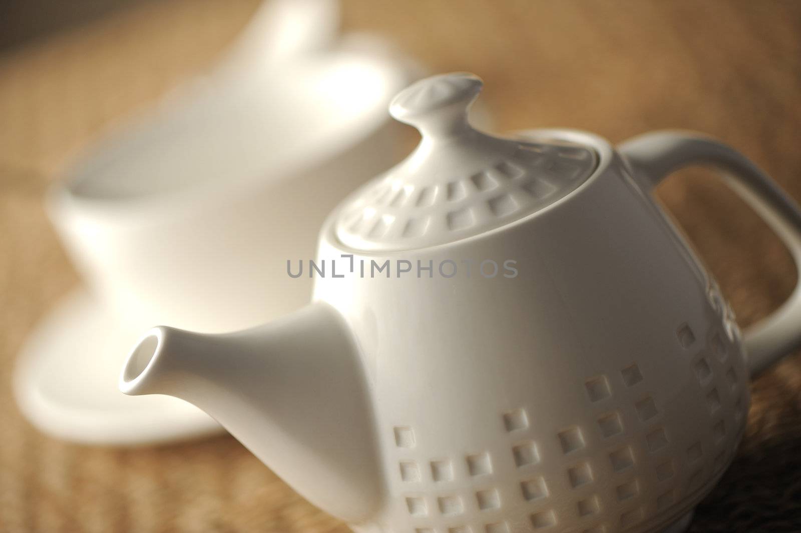 teapot on table, close up, shallow dof by stokkete