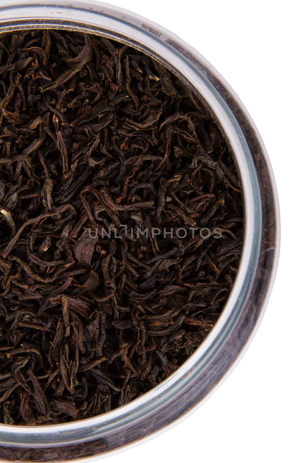 Dry black tea leaves isolated on white