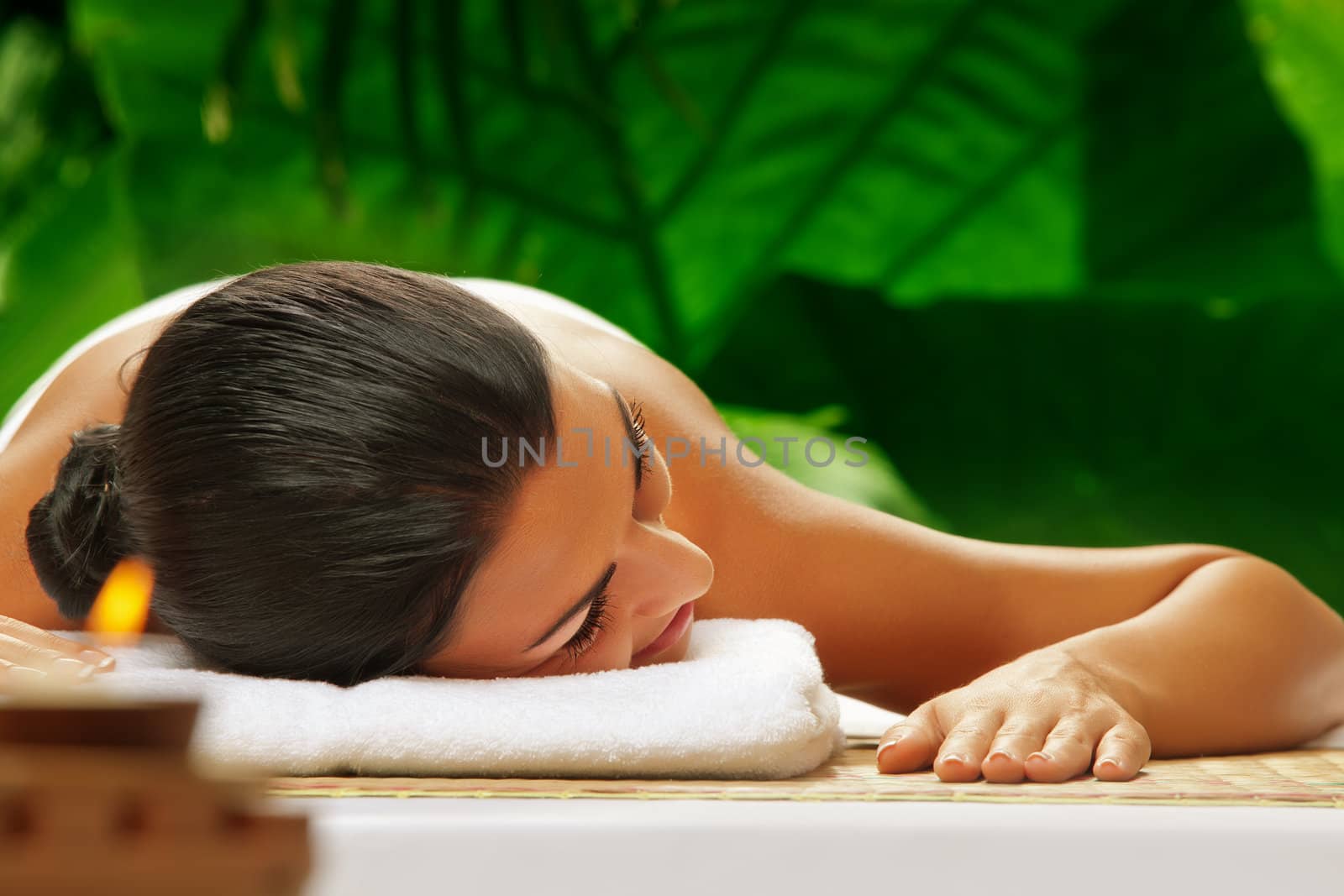 portrait of young beautiful woman in spa environment.