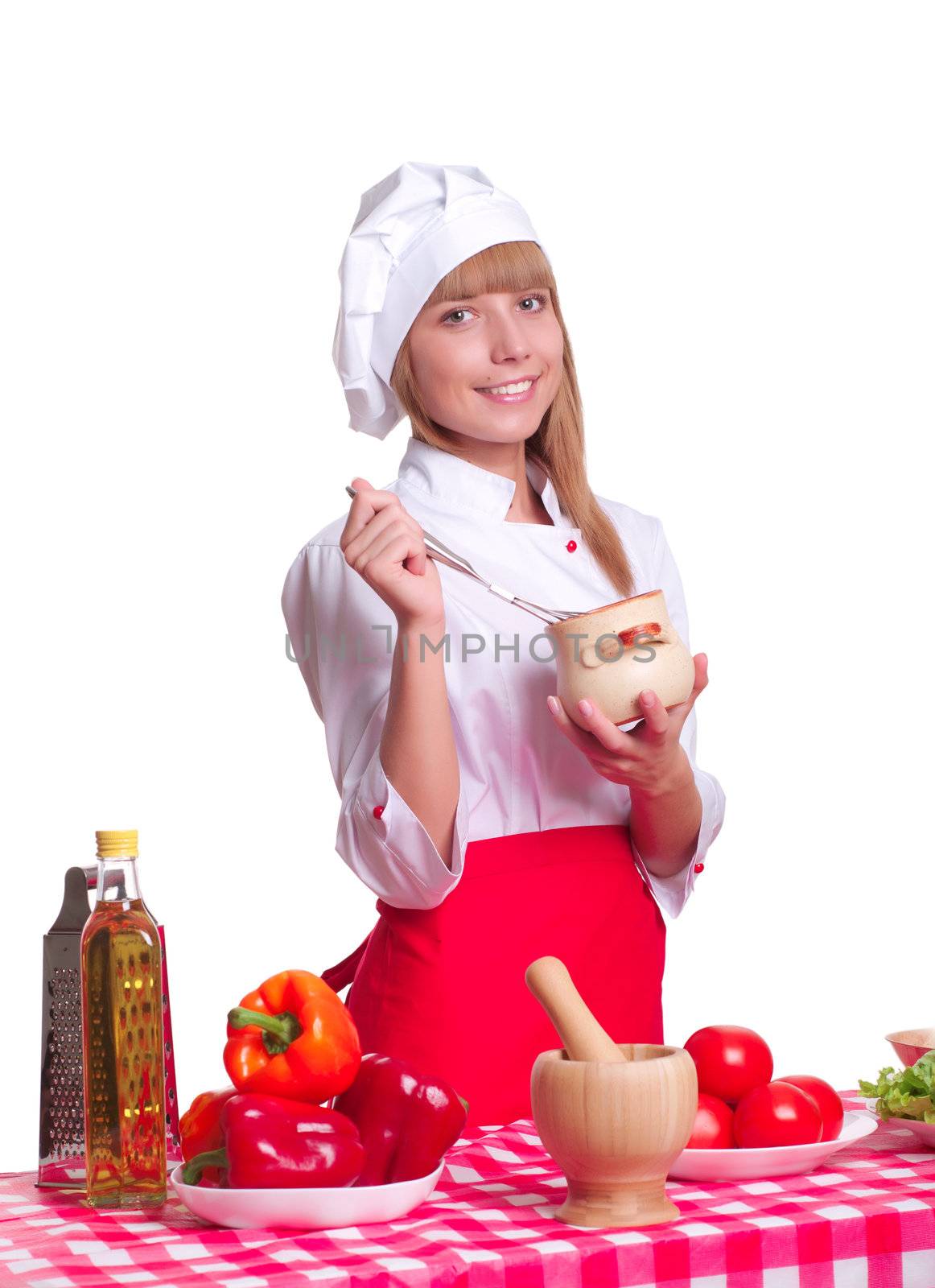 beautiful woman looking into a pot of food, cooking vegetables