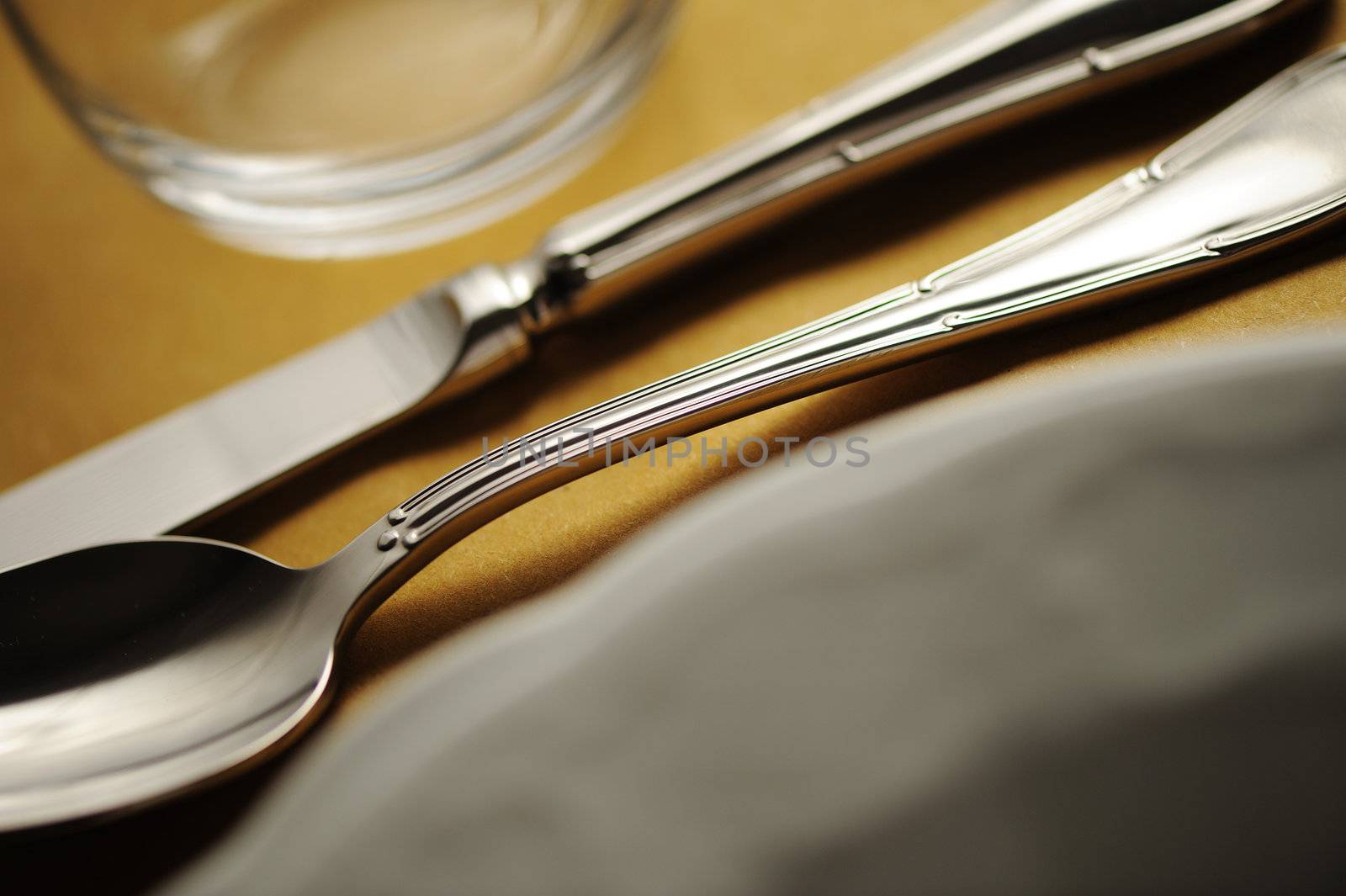 Elegant close up of a restaurant table, with a soft light by stokkete