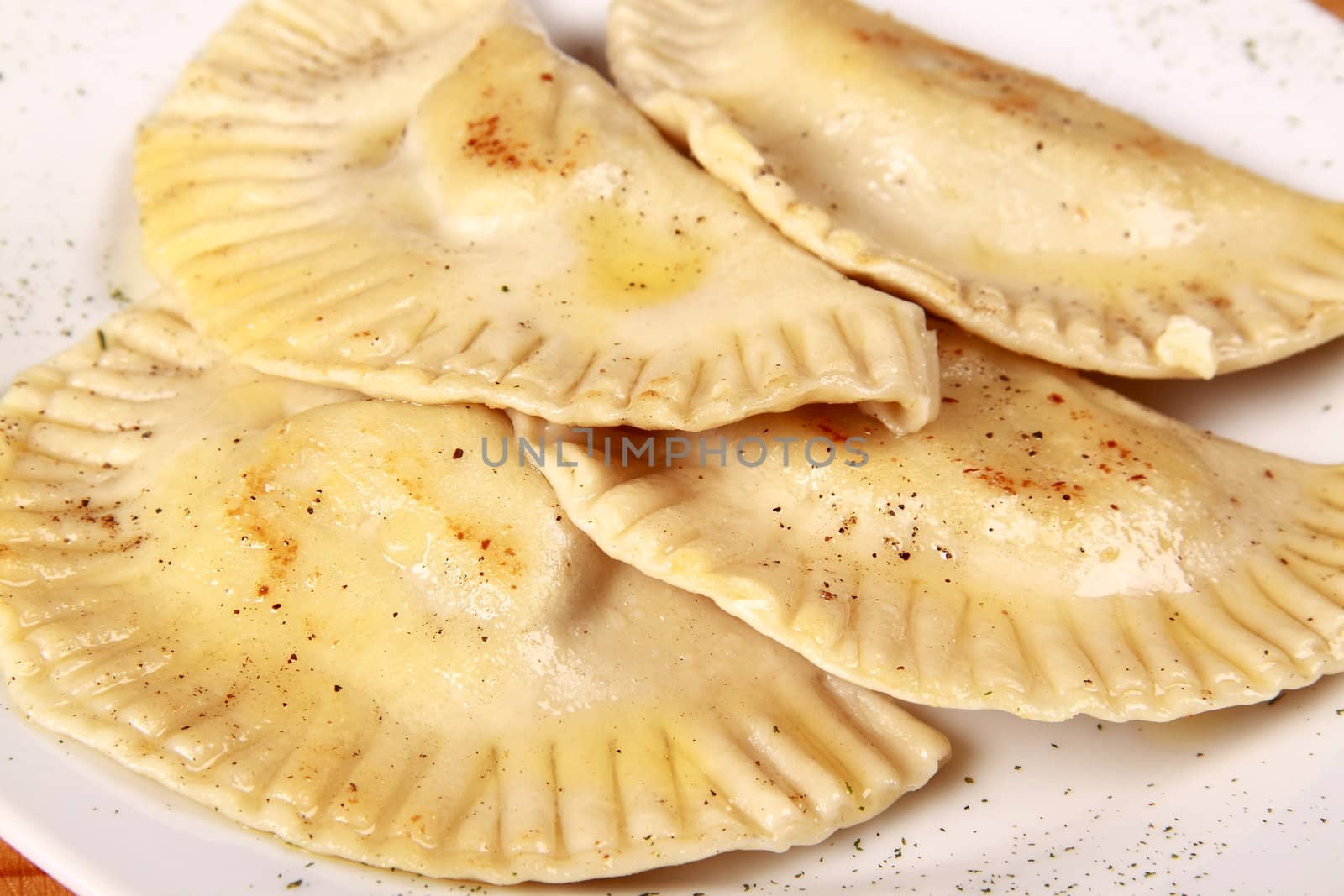 raviolli on plate isolated on white background