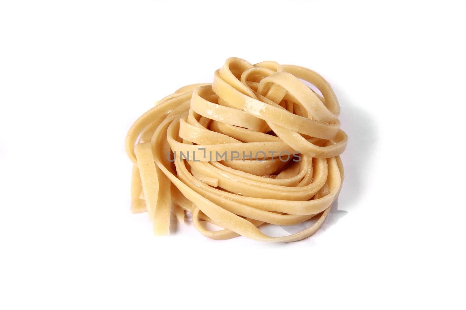 white bowl with boiled spaghetti on plate