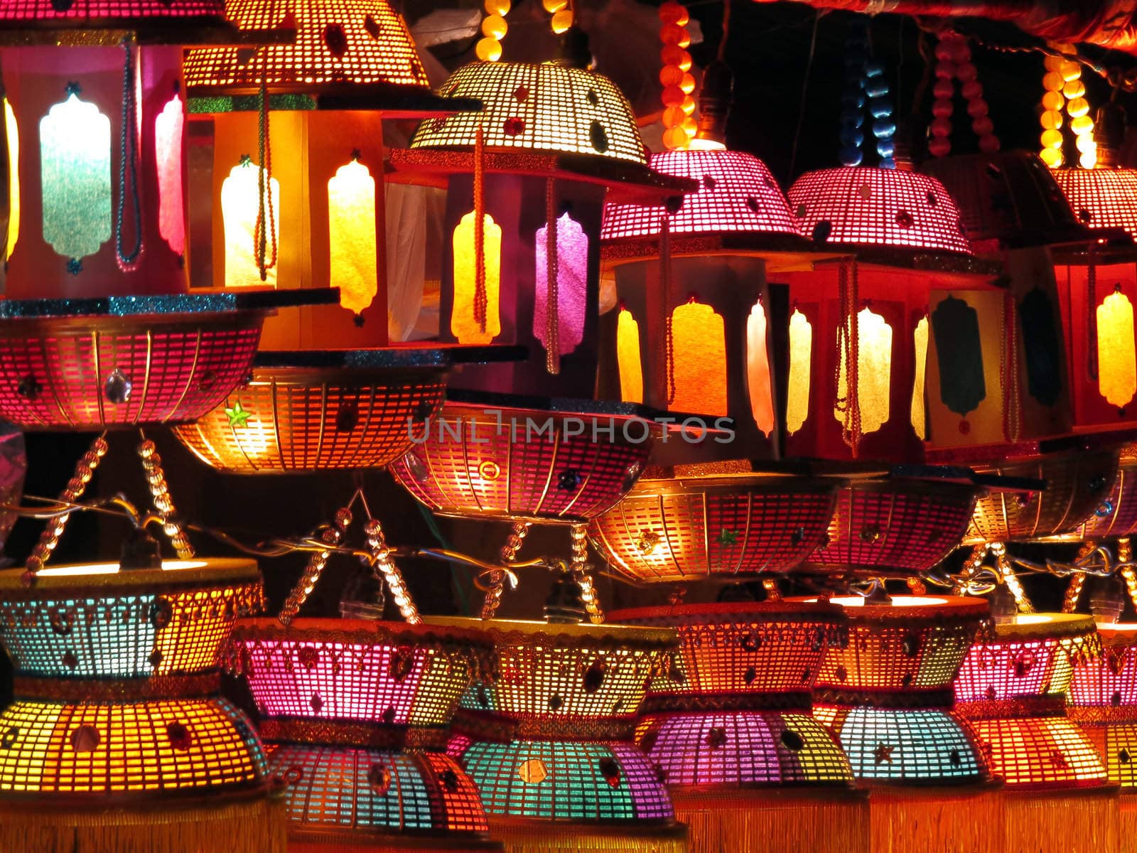 Traditional handmade Indian lanterns in beautiful colors for sale at a shop.                               