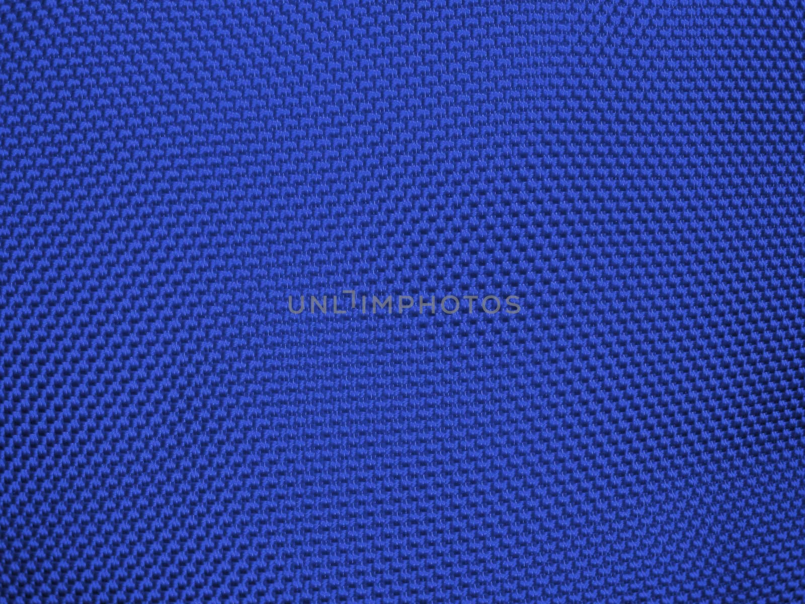 Knit woolen texture. Fabric blue background