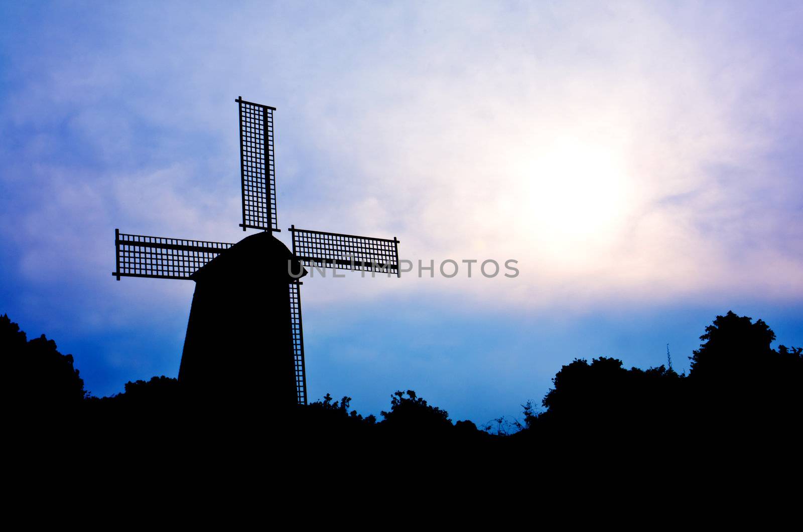 silhouette Wind generator on colorful sky