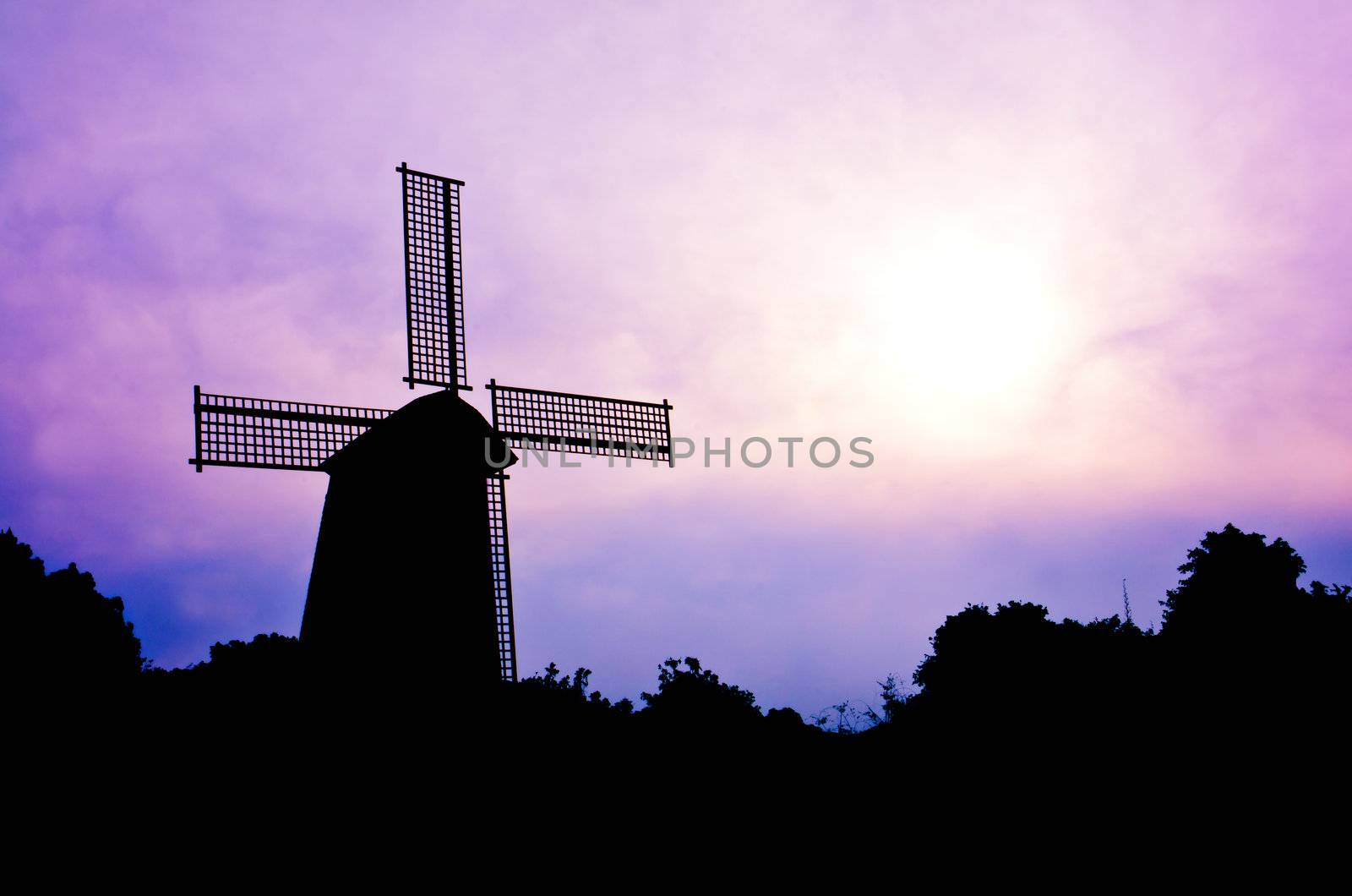 silhouette Wind generator on colorful sky