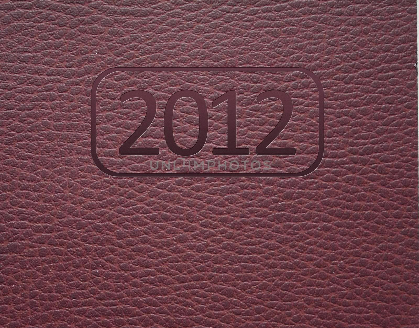 Year 2012 text on leather background