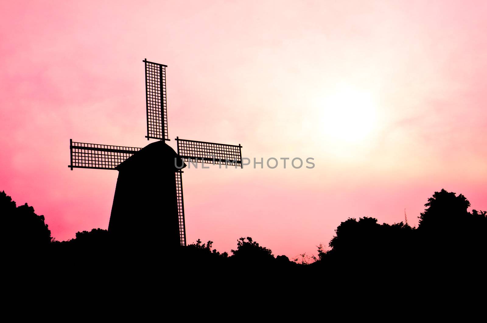 silhouette Wind generator on colorful sky