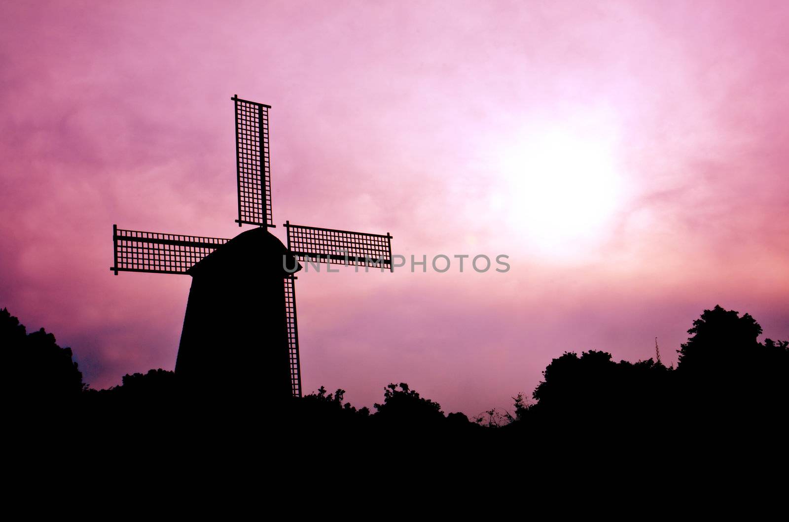 silhouette Wind generator on colorful sky