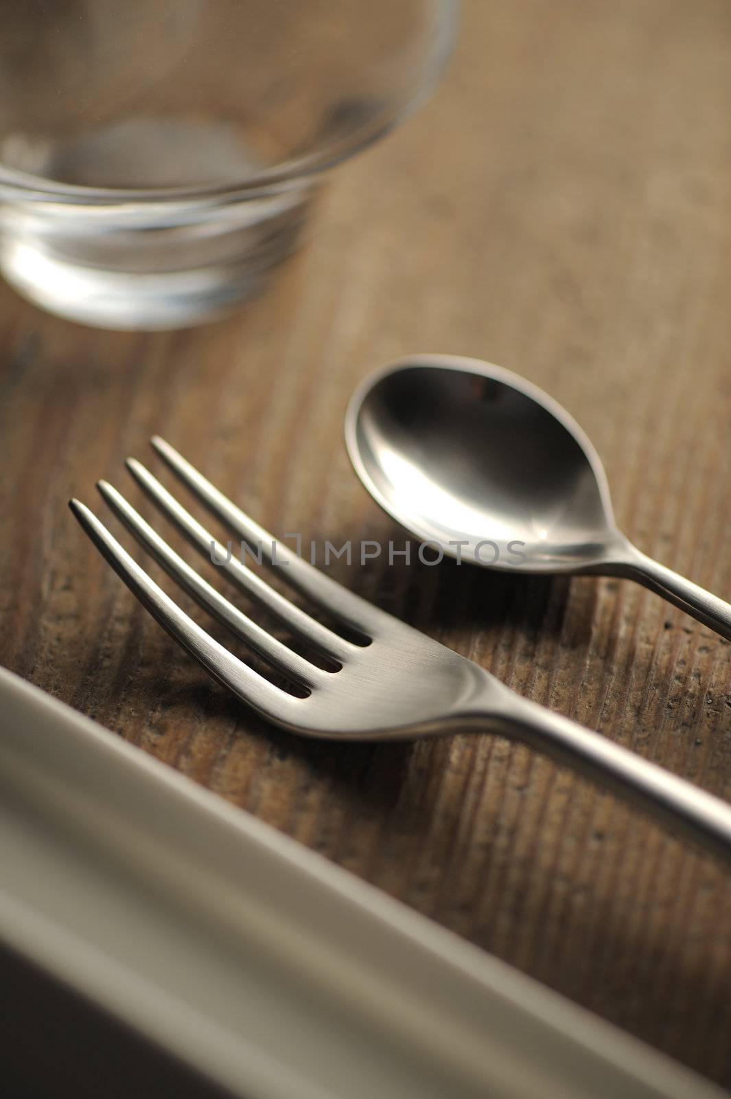 Close-up of silverware , on the dining table. by stokkete