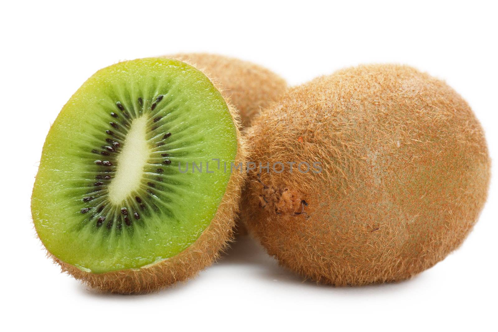 Closeup view of a kiwi fruits isolated over white background