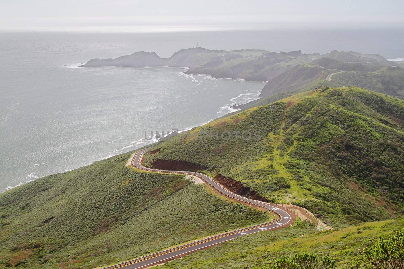 Road by the ocean on hills